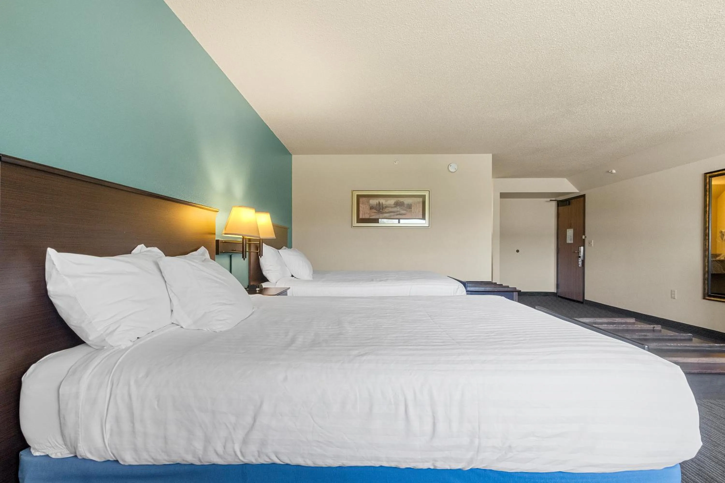 Bed in AmericInn by Wyndham Green Bay East