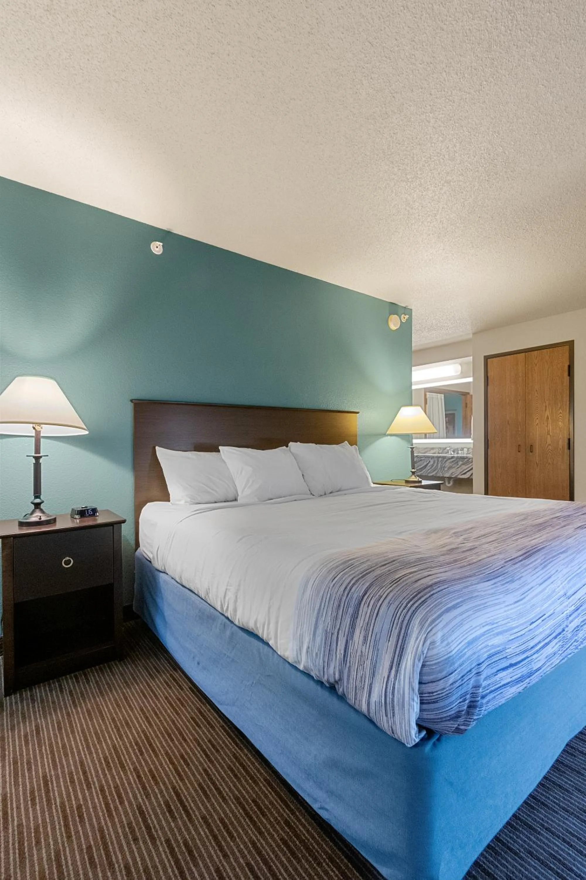 Bed in AmericInn by Wyndham Green Bay East