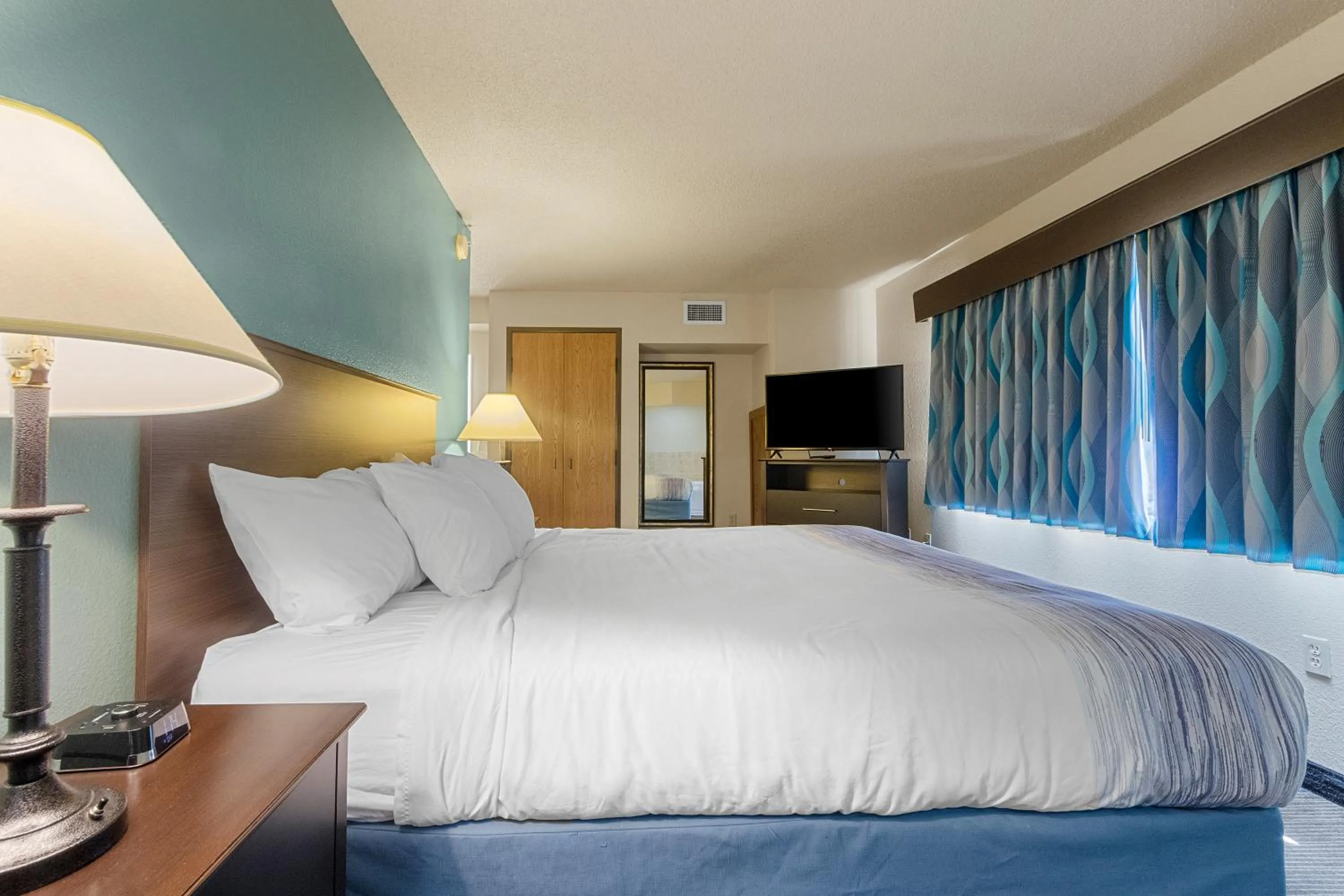 Bed in AmericInn by Wyndham Green Bay East