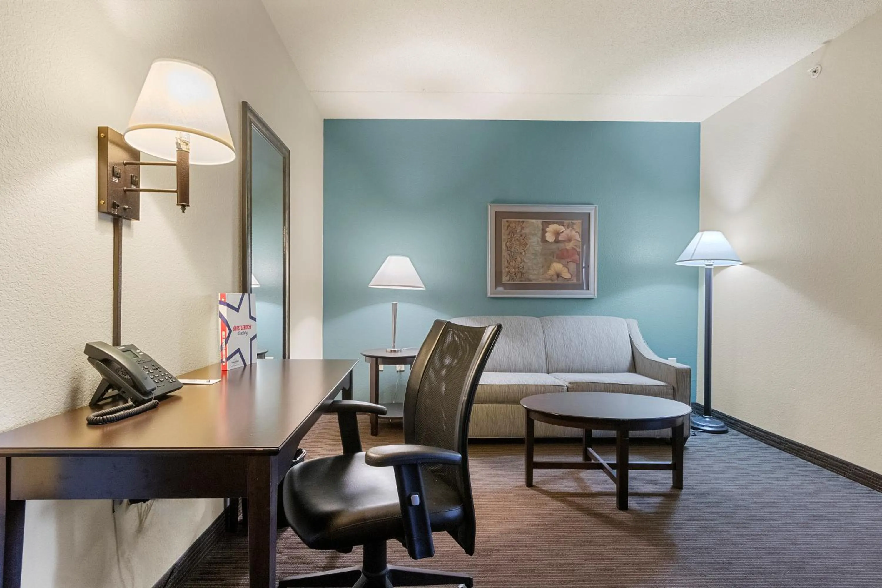 Living room in AmericInn by Wyndham Green Bay East