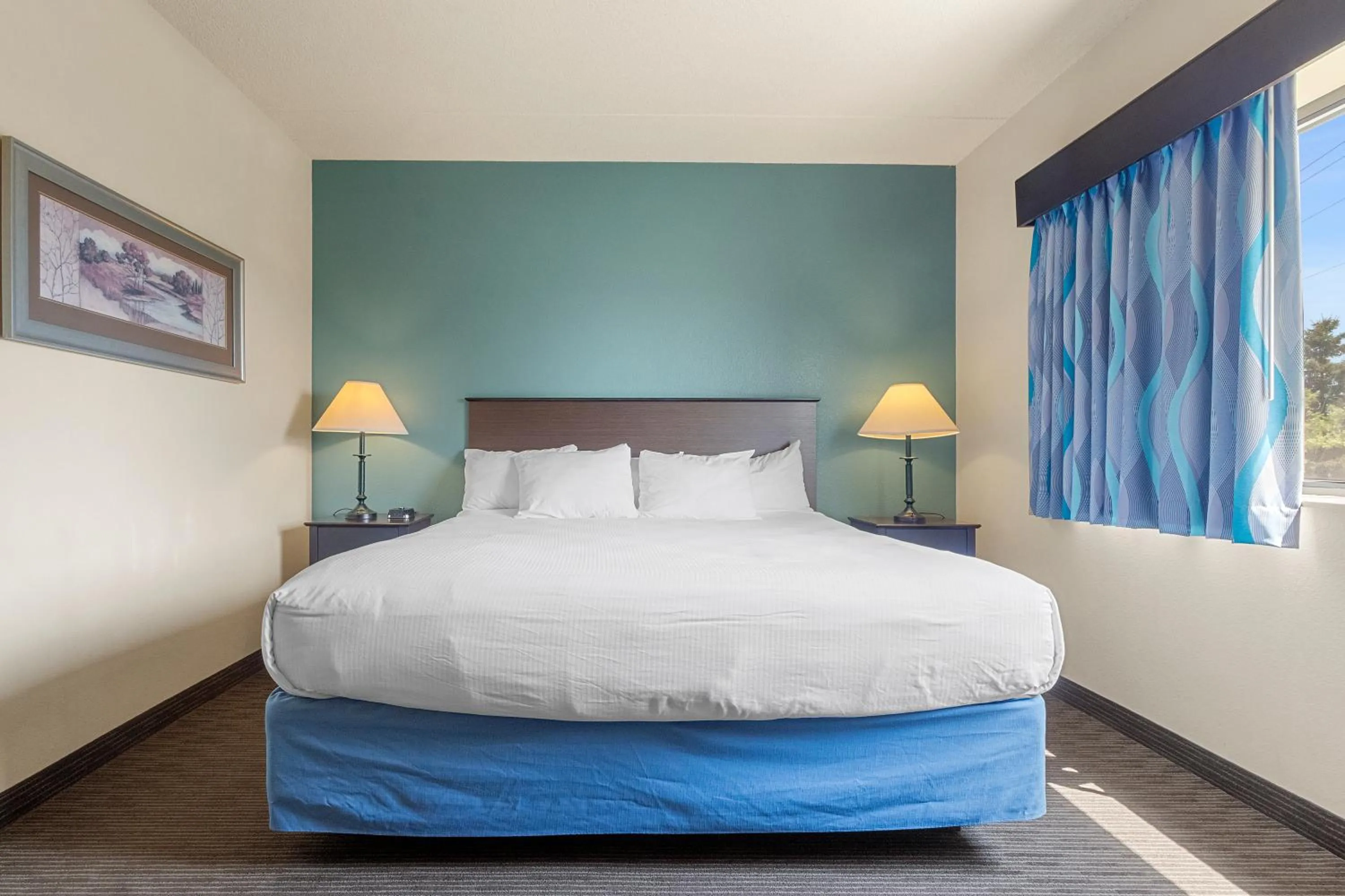 Bed in AmericInn by Wyndham Green Bay East