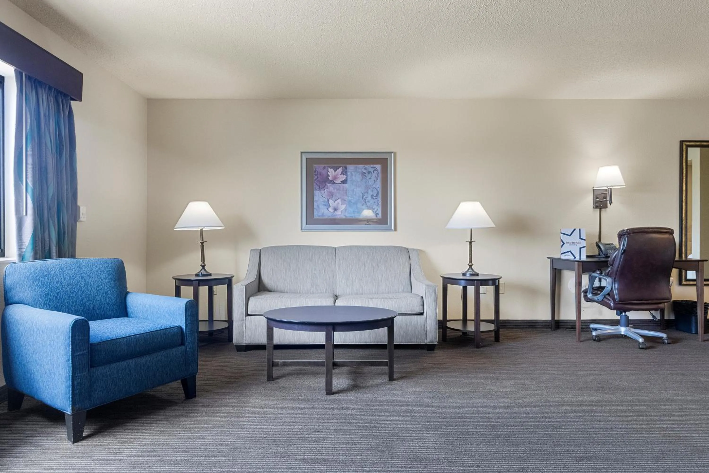 Living room in AmericInn by Wyndham Green Bay East