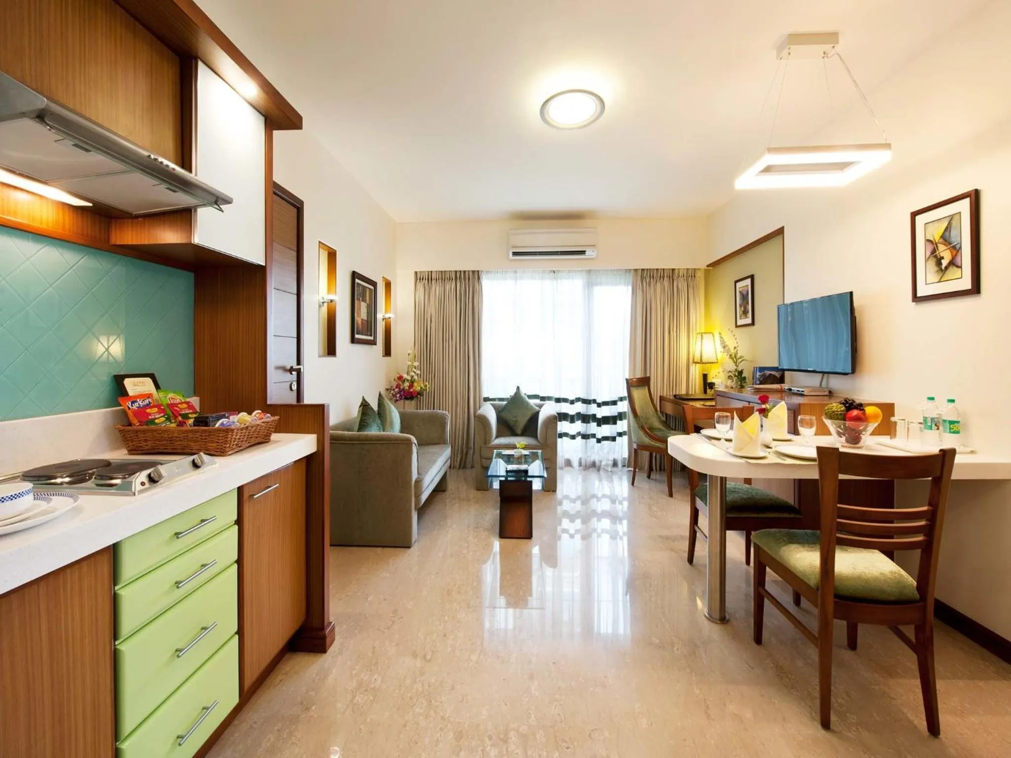 Kitchen or kitchenette in Grand Residency Hotel & Serviced Apartments