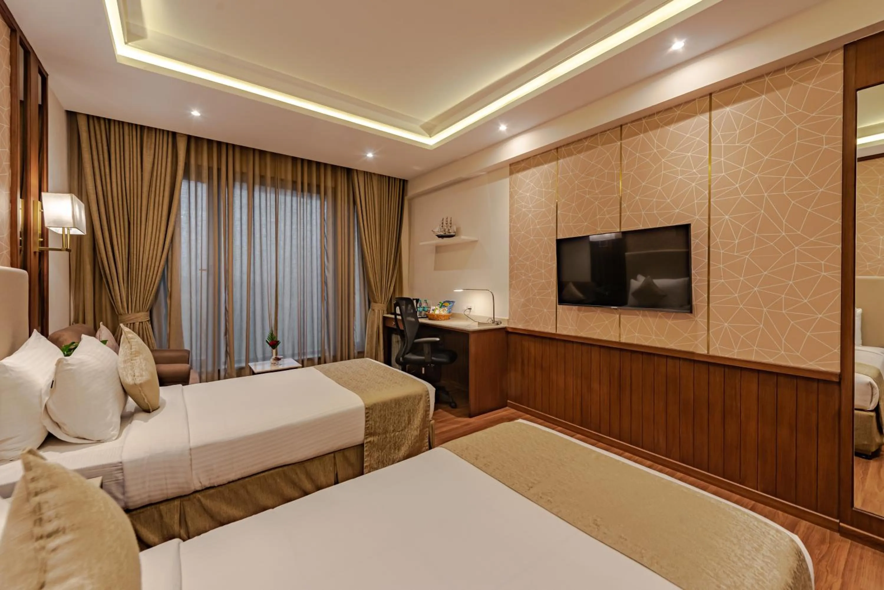 Bed in Goldfinch Hotel Mangalore