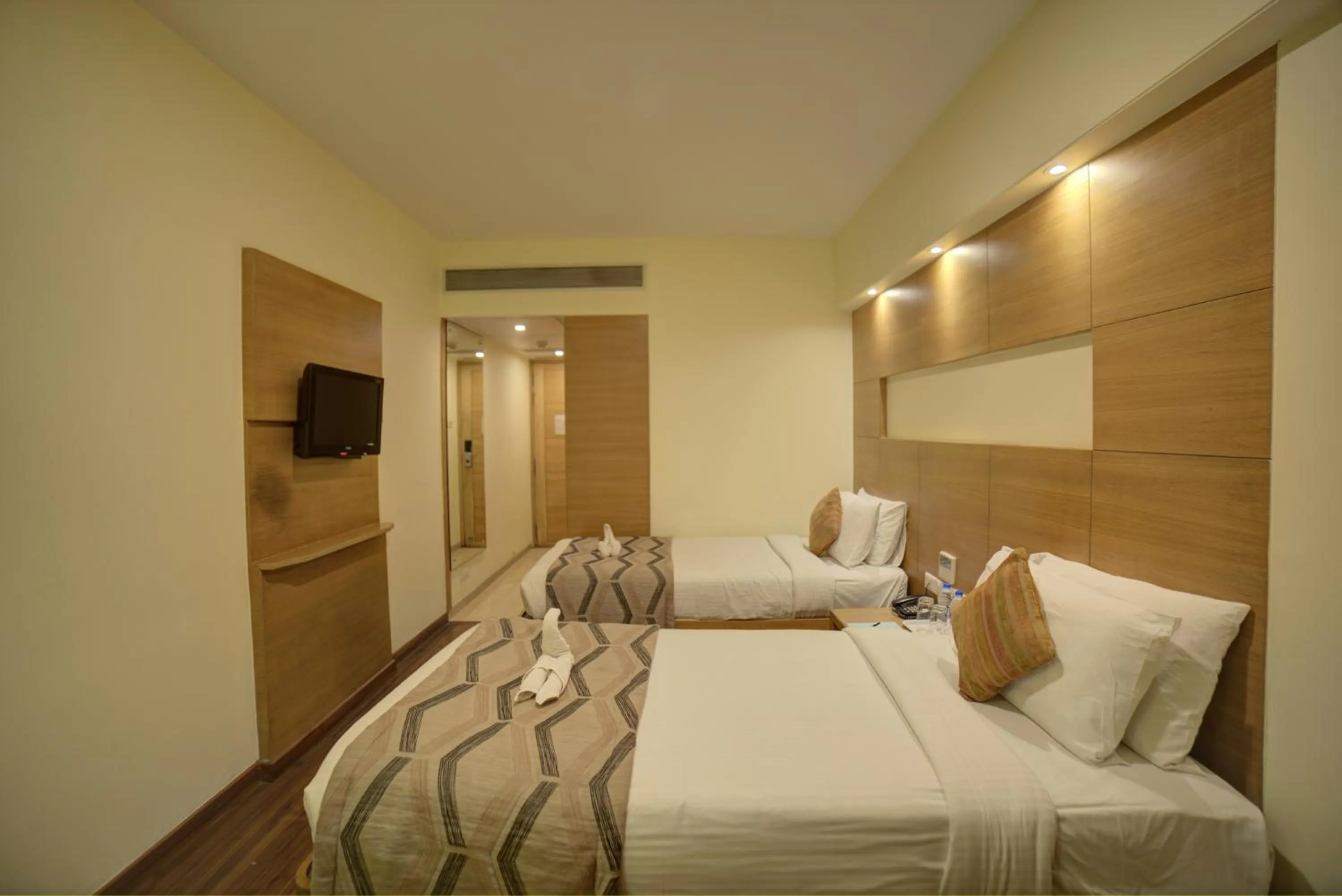 Bed in Coraltree Hotel Bangalore