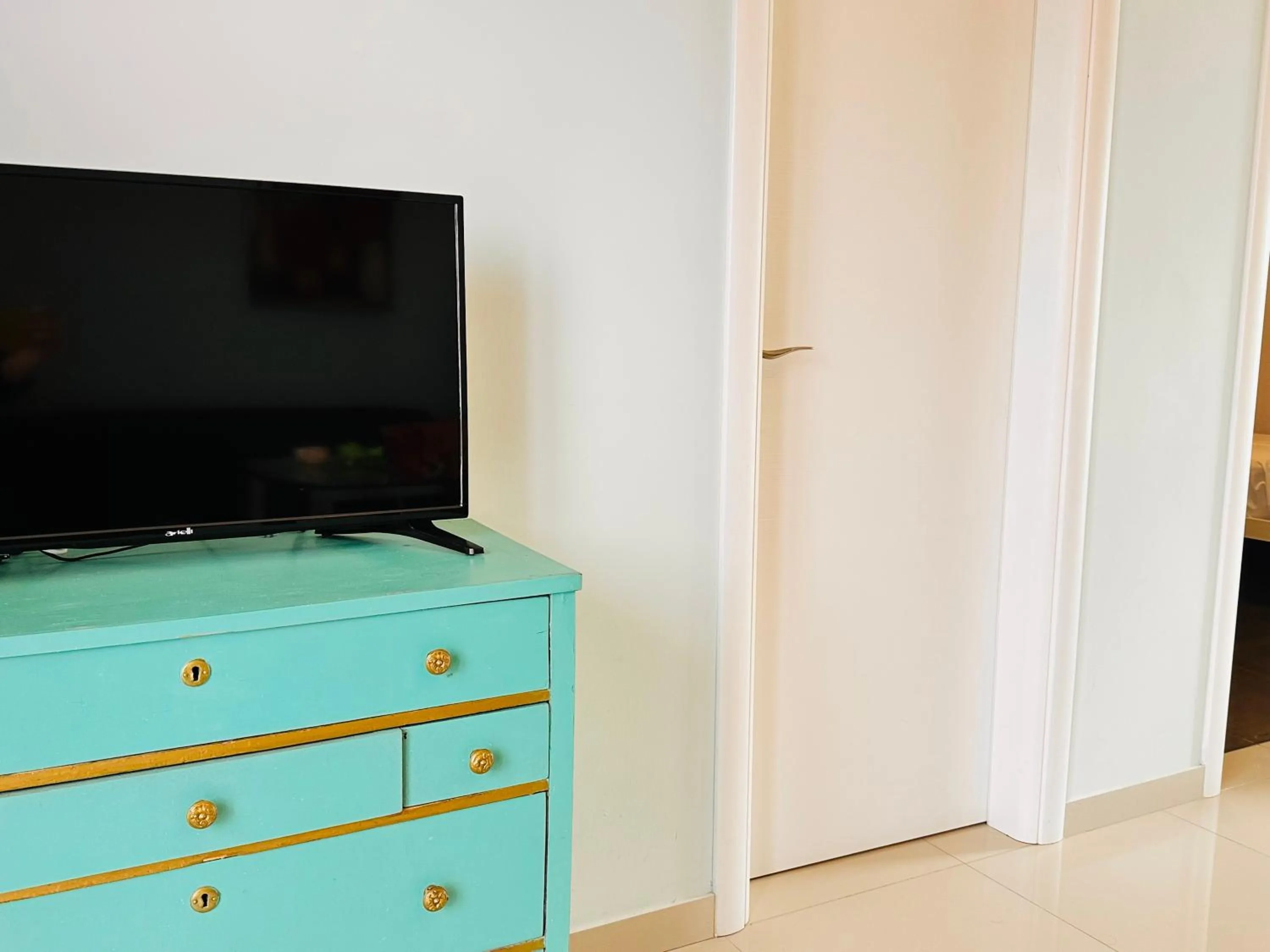 TV and multimedia in Infinity blue beach apartments - Renovated Apartments 2 Minutes from the Sea & Pool with Scenic Views