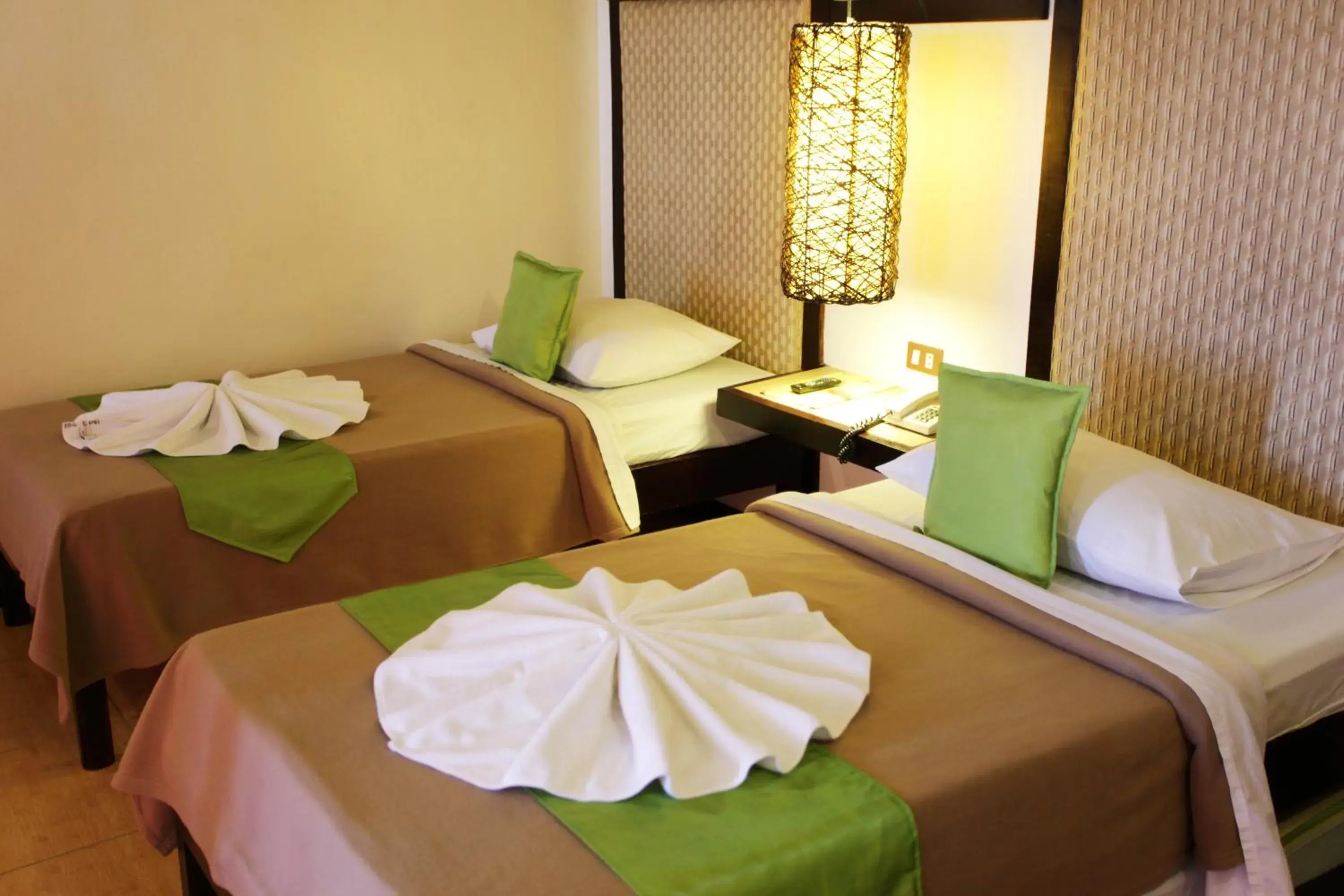 Bed in Eagle Point Beach and Dive Resort Bed in Eagle Point Beach and Dive Resort