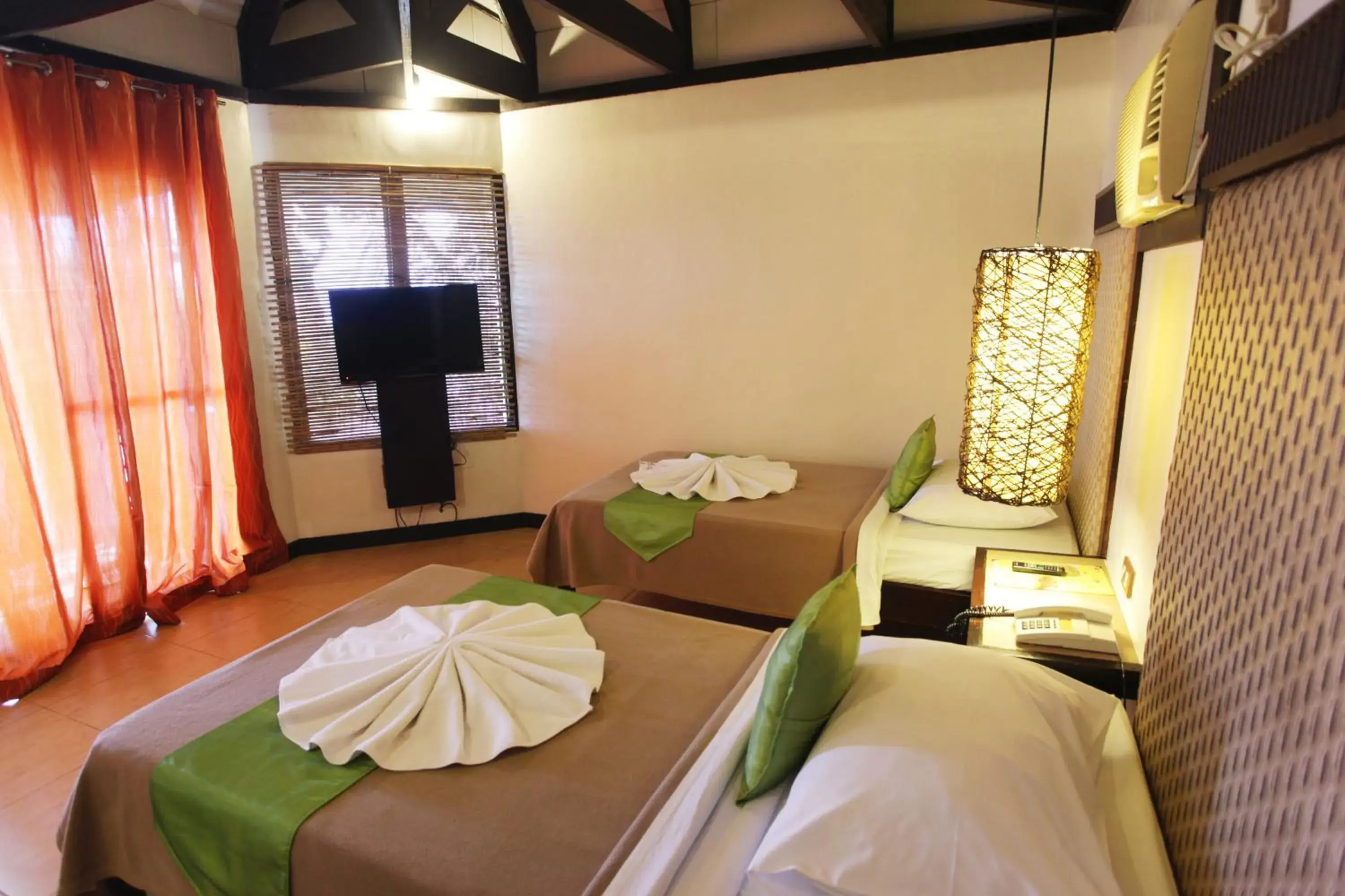 Bed in Eagle Point Beach and Dive Resort Bed in Eagle Point Beach and Dive Resort