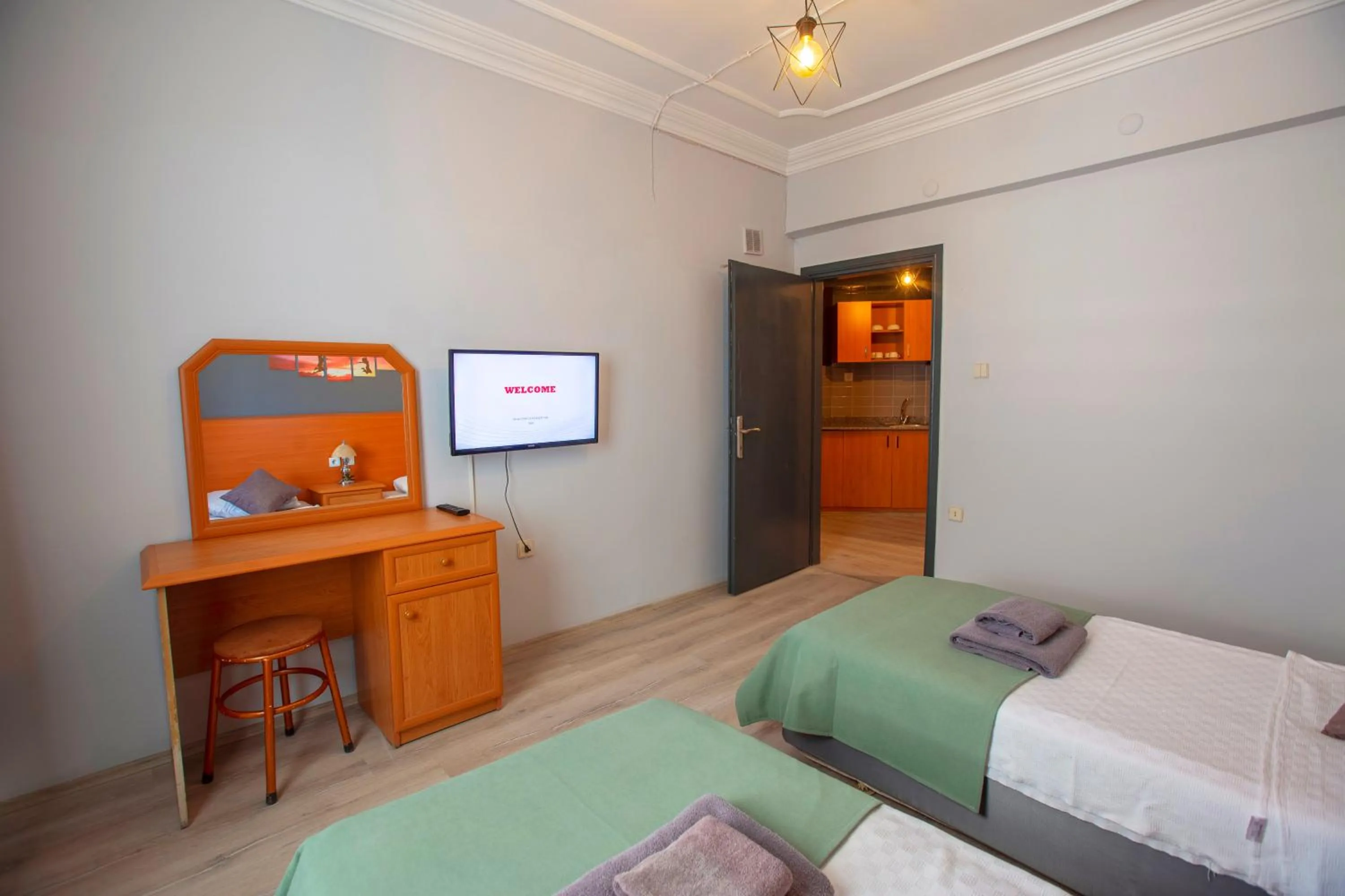 Communal lounge/ TV room, Bed in HMA Hotel & Suites