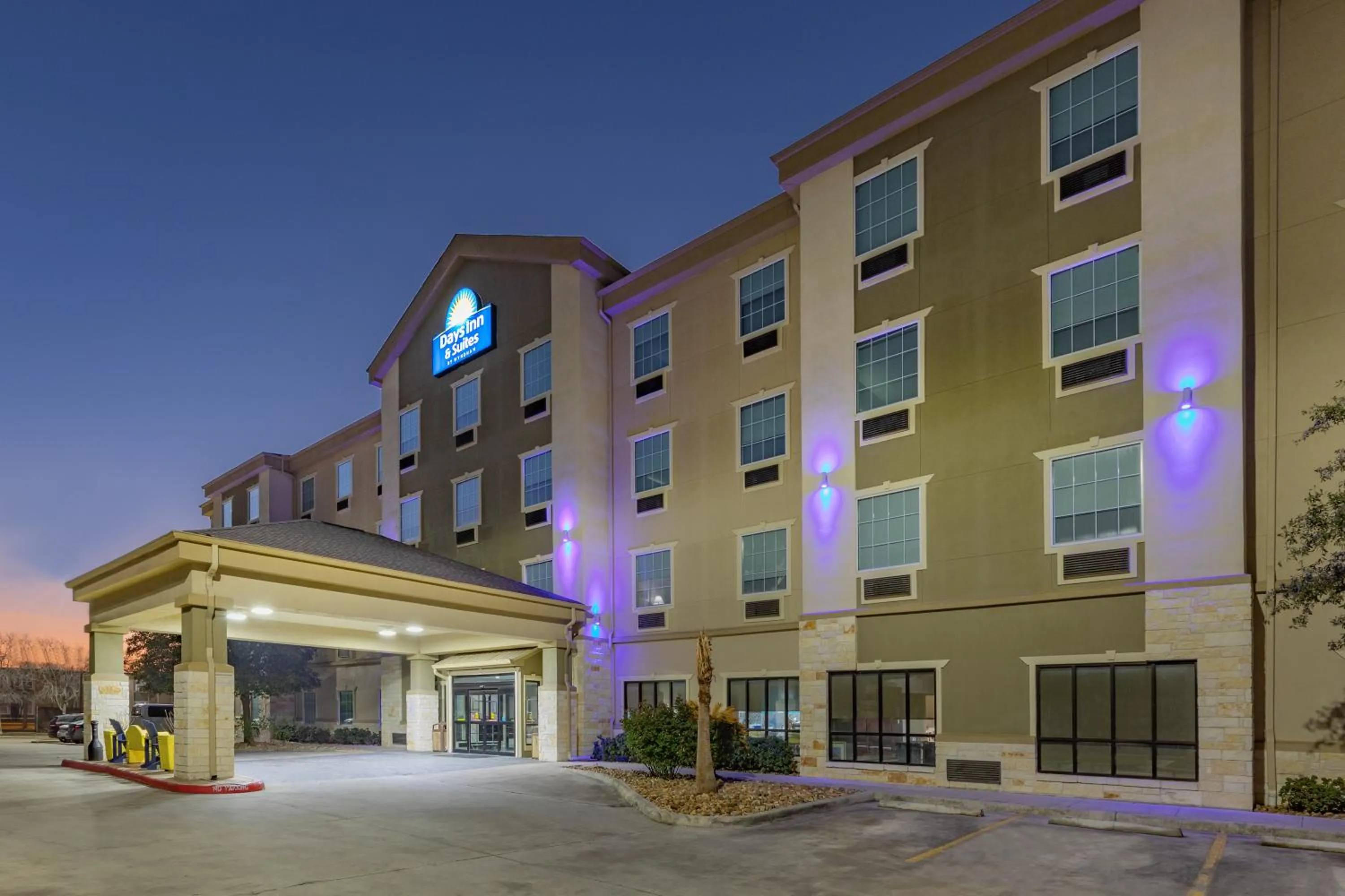 Property building in Days Inn & Suites by Wyndham San Antonio near Frost Bank Center