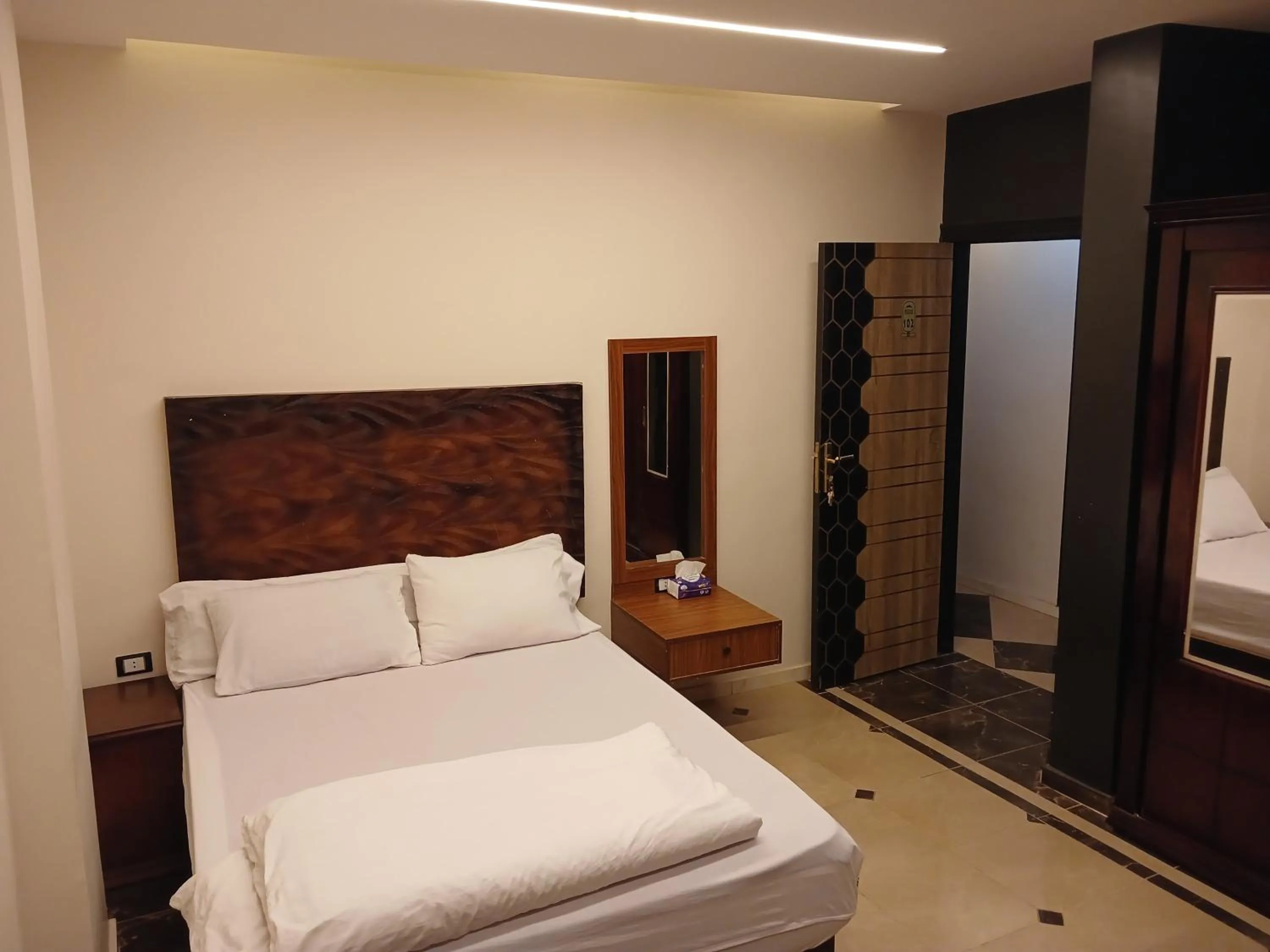 Bed in Royal Pyramids Inn