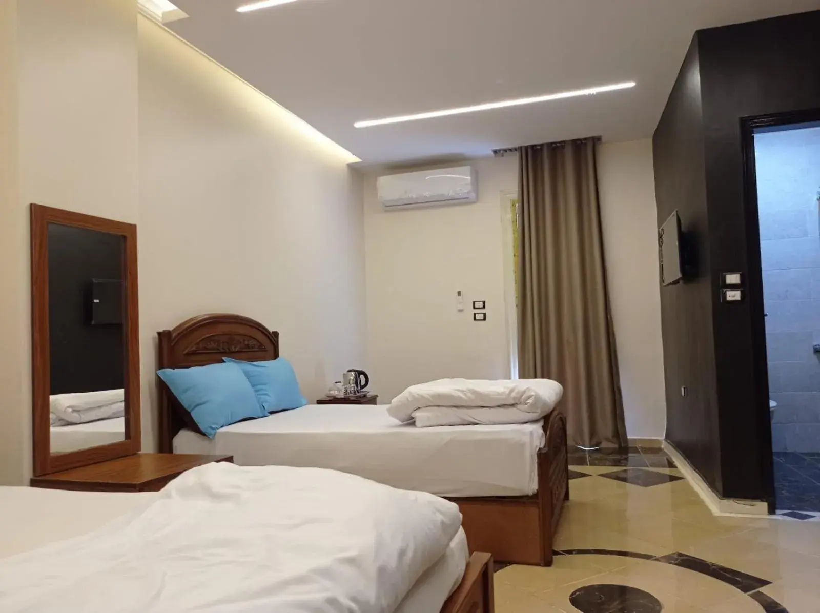 Bed in Royal Pyramids Inn Bed in Royal Pyramids Inn