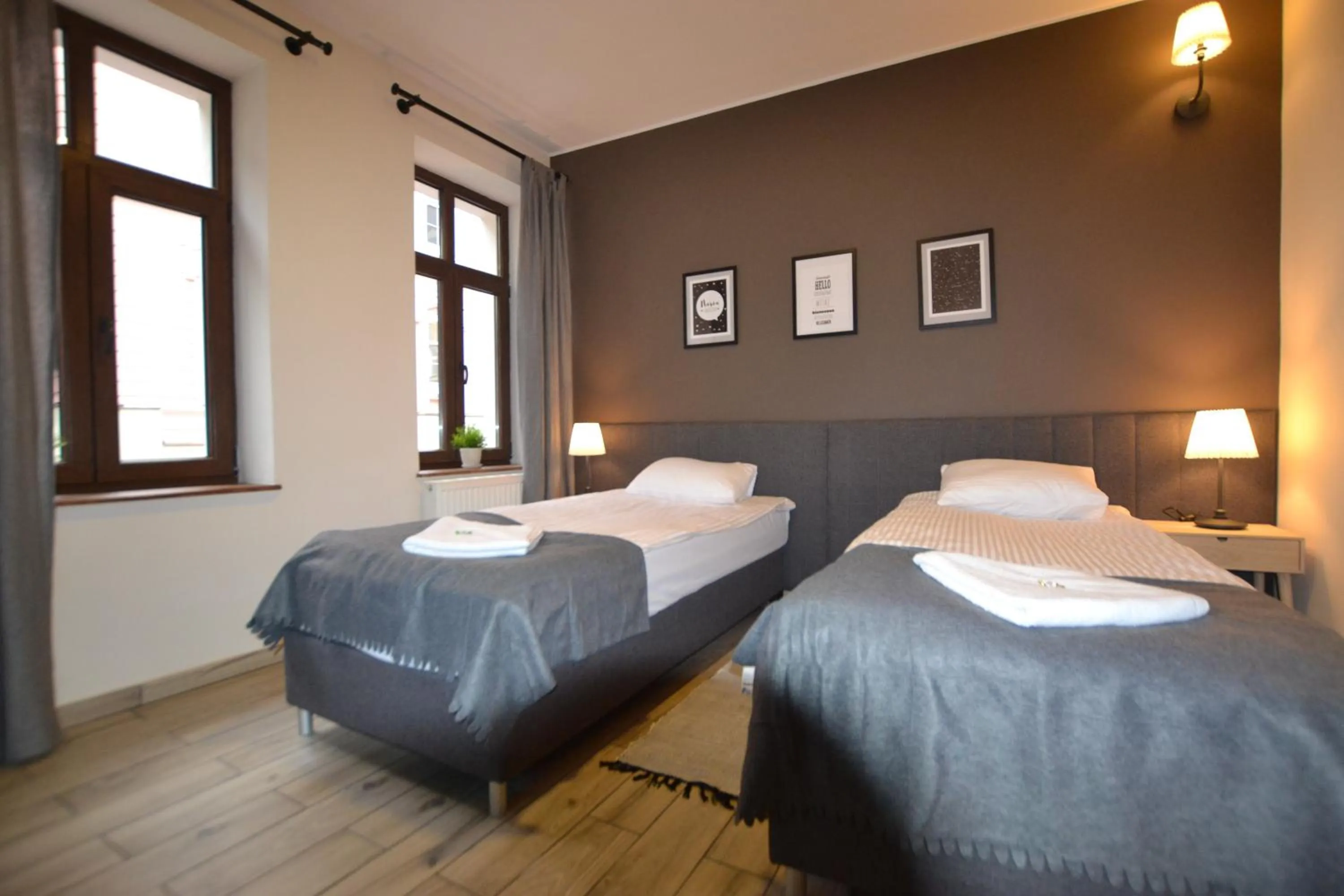 Bed in SleepWell Apartments