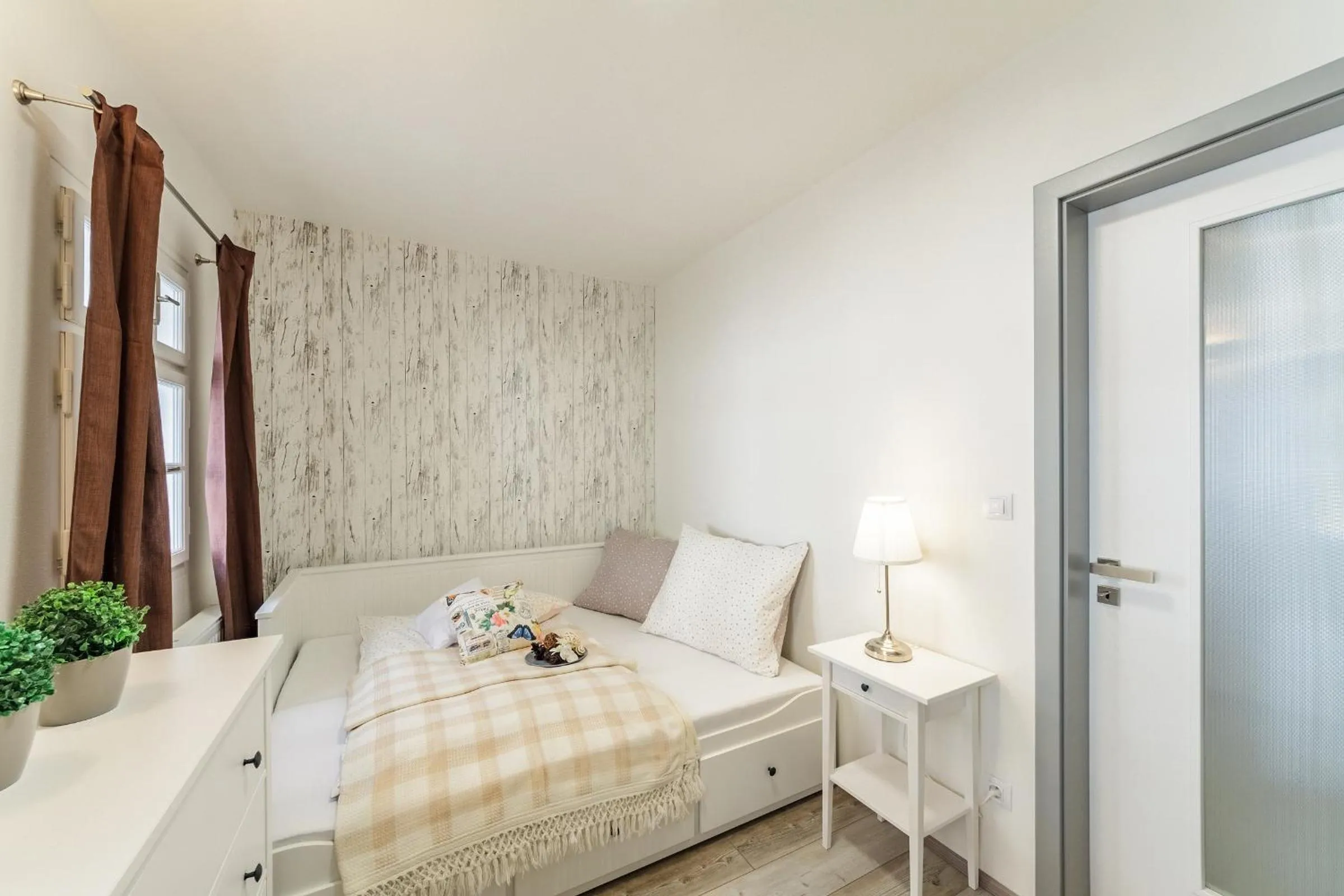 Bed in Downtown Royal Apartments