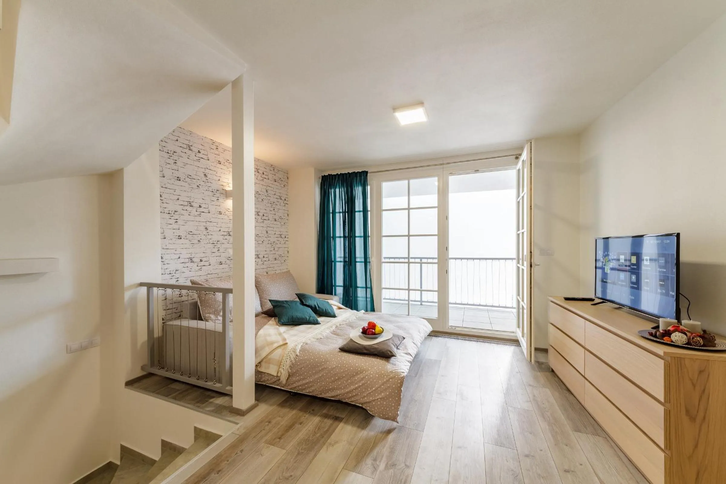 Bed in Downtown Royal Apartments
