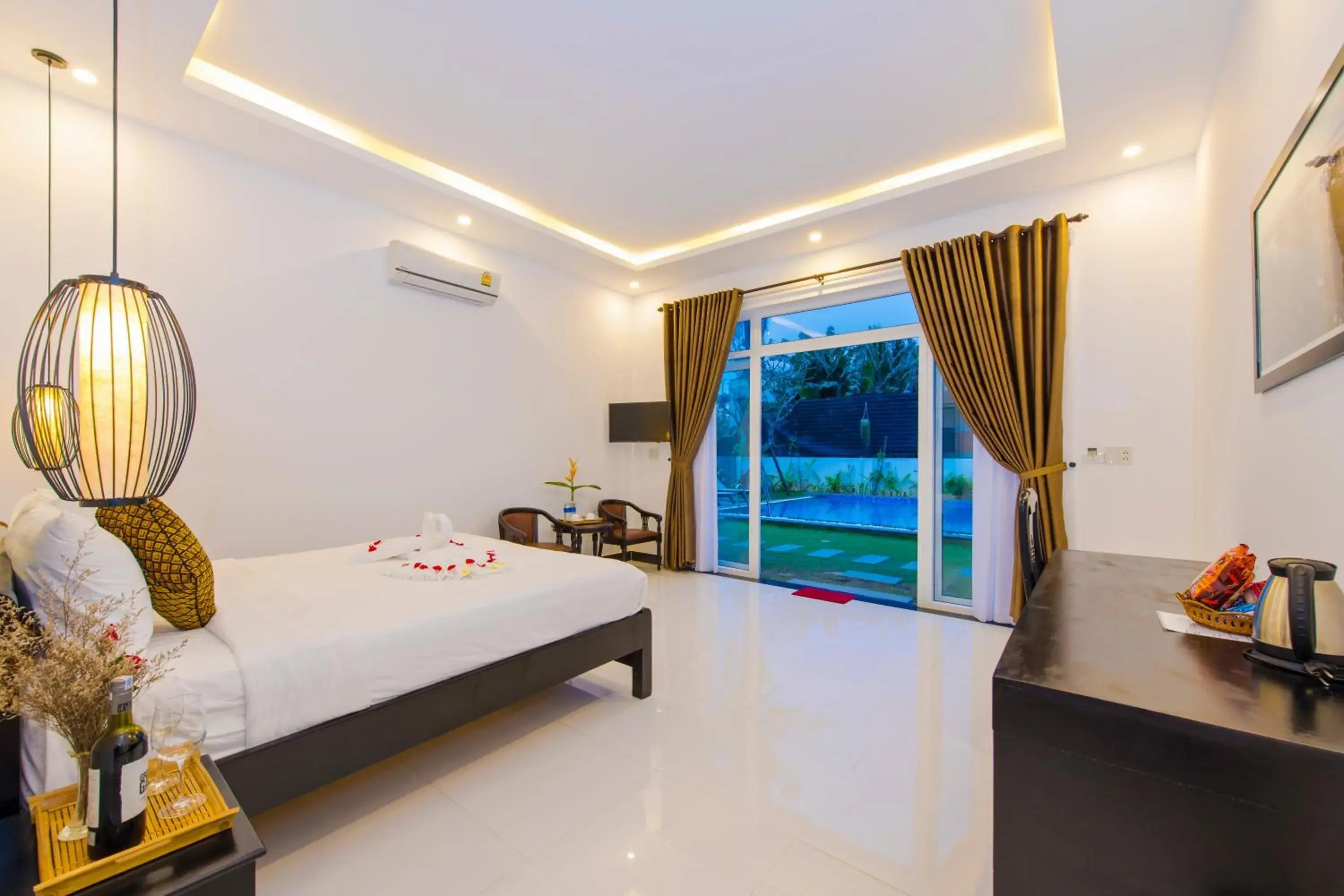 Seating area, Bed in Hoi An Sunny Pool Villa Seating area, Bed in Hoi An Sunny Pool Villa