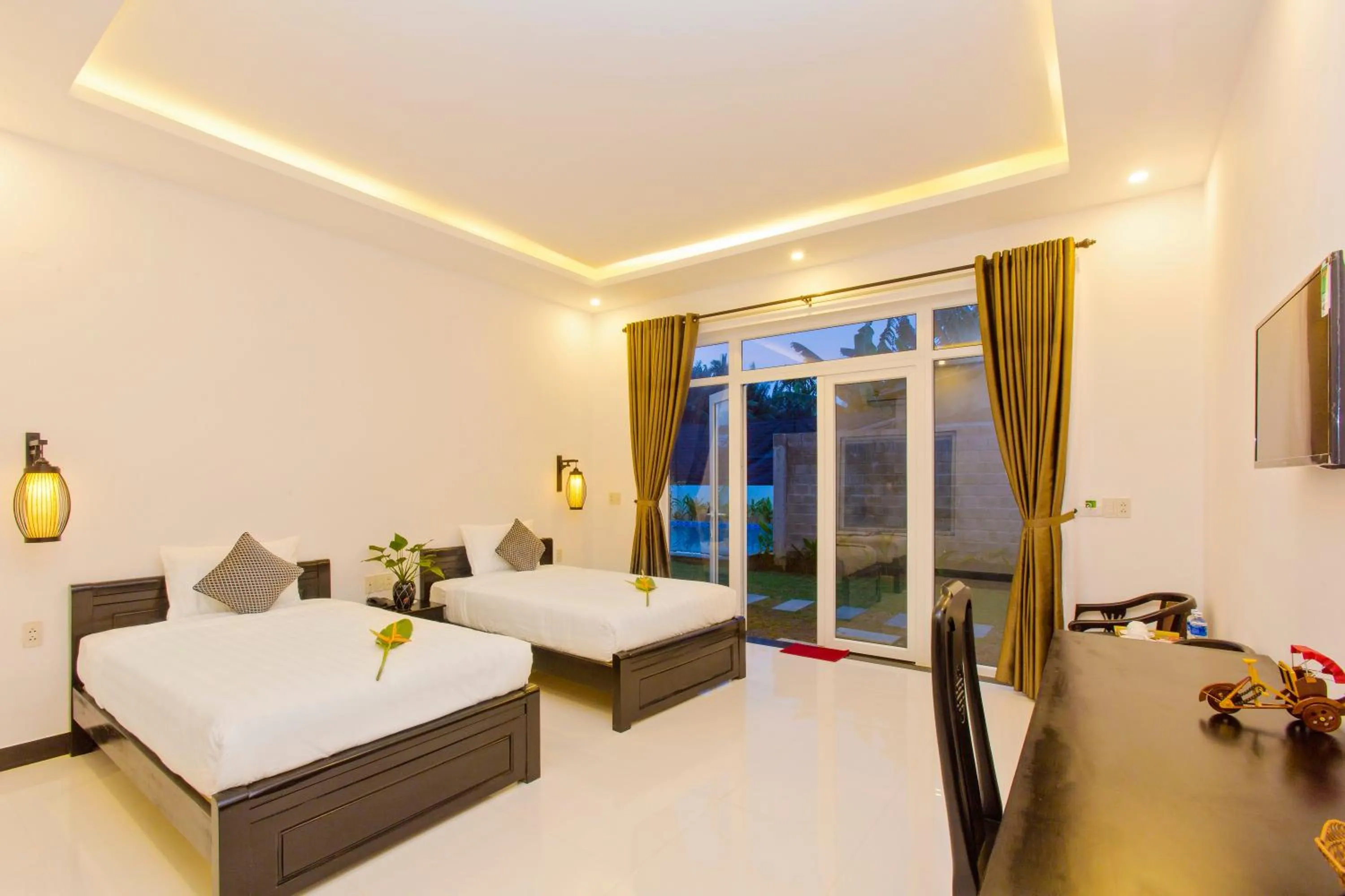 Seating area, Bed in Hoi An Sunny Pool Villa