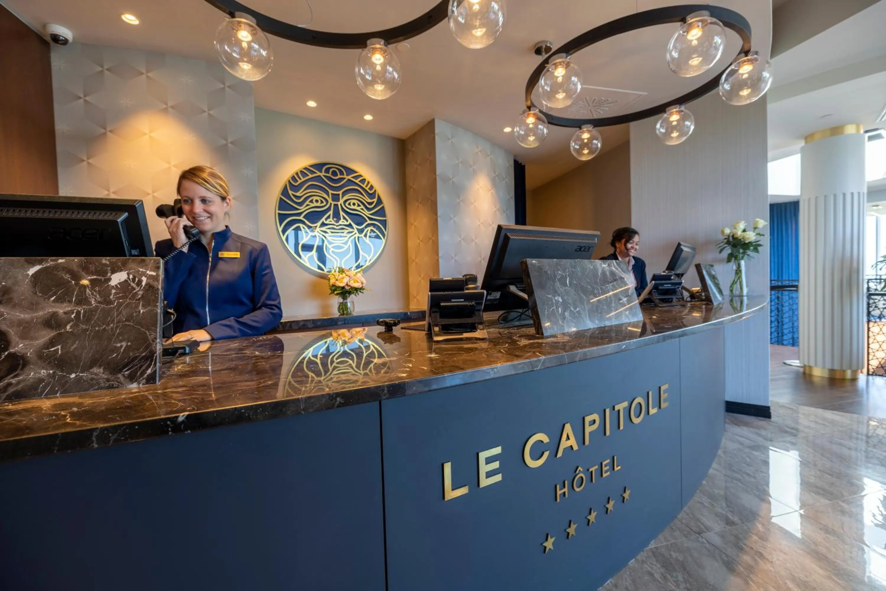 Lobby or reception in Le Capitole Hotel