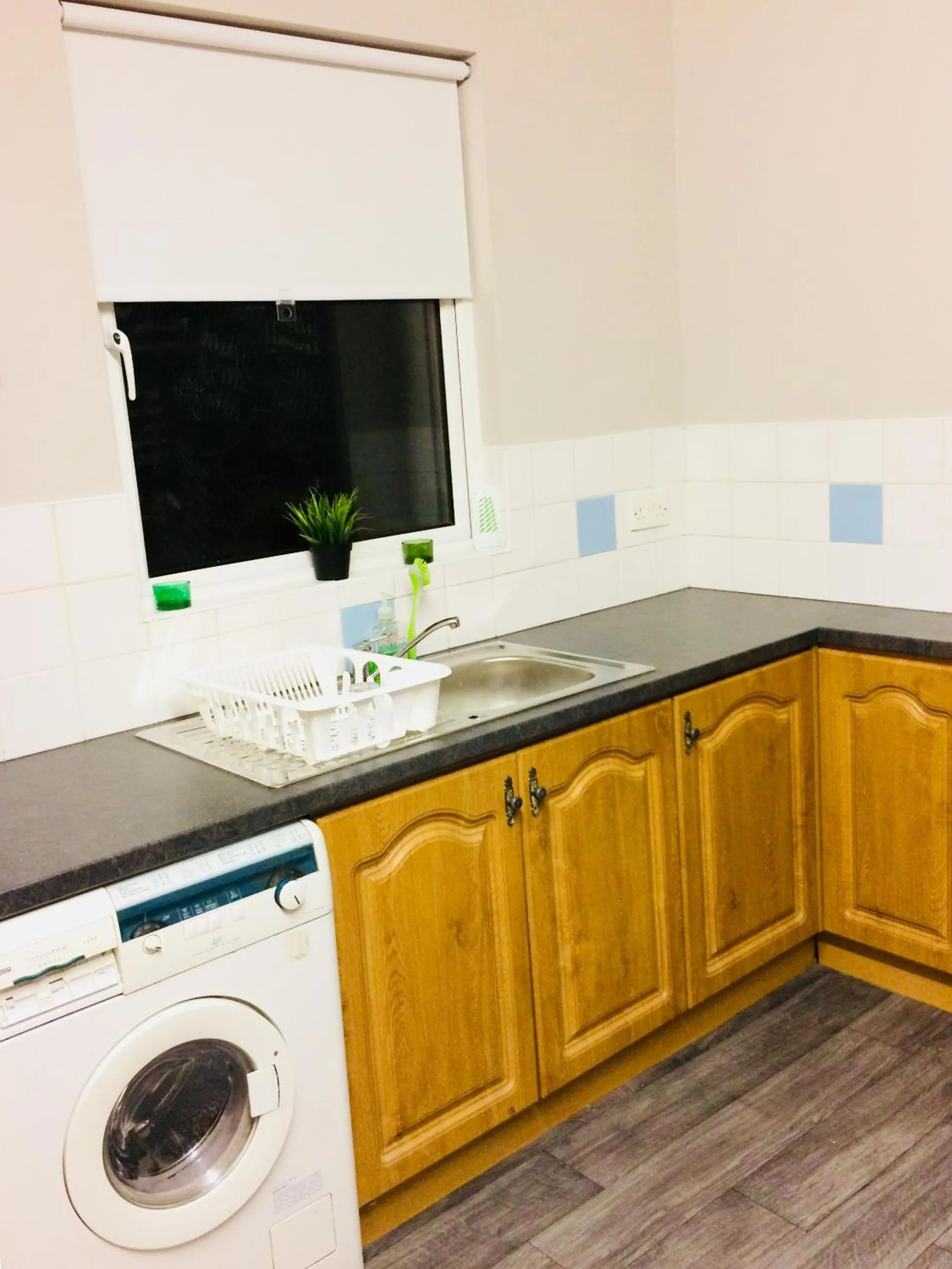 Communal kitchen in Lwr Ormeau Guest House