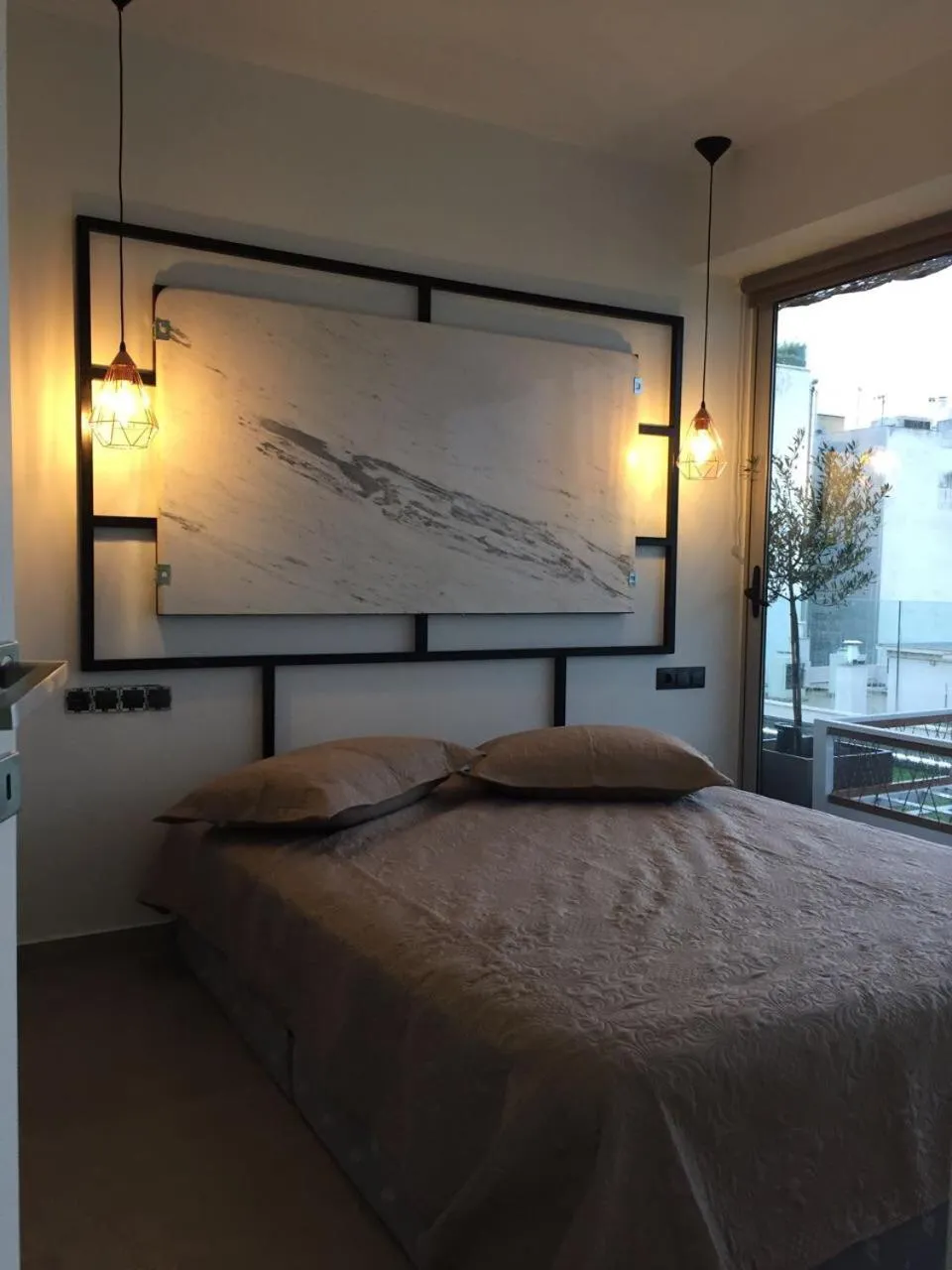 Bed in The Athenians Modern Apartments