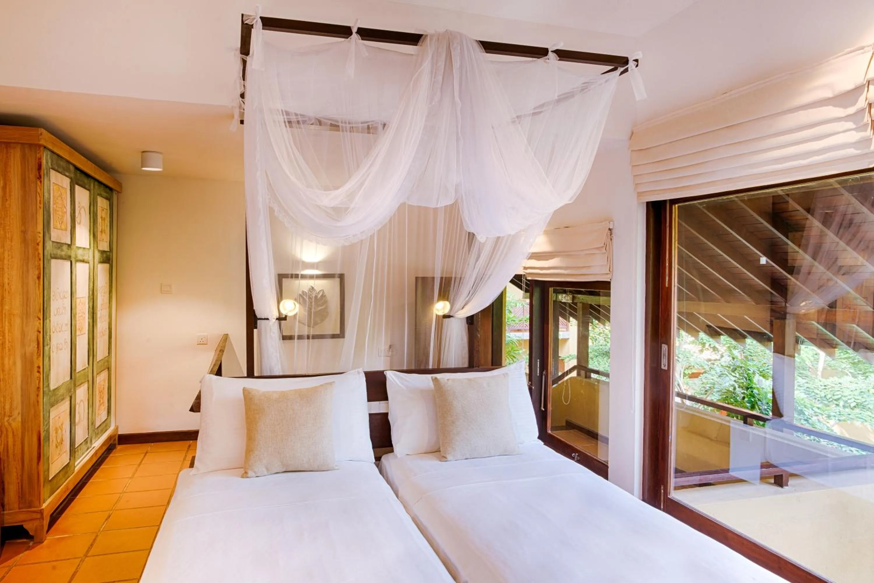 Bed in Jetwing Ayurveda Pavilions