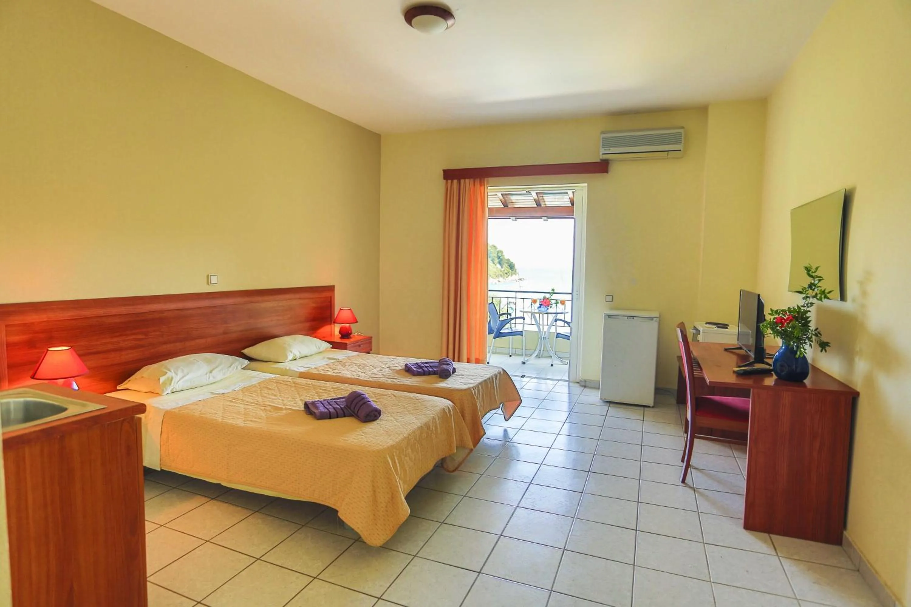 Bed in Amfitriti Hotel & Studios