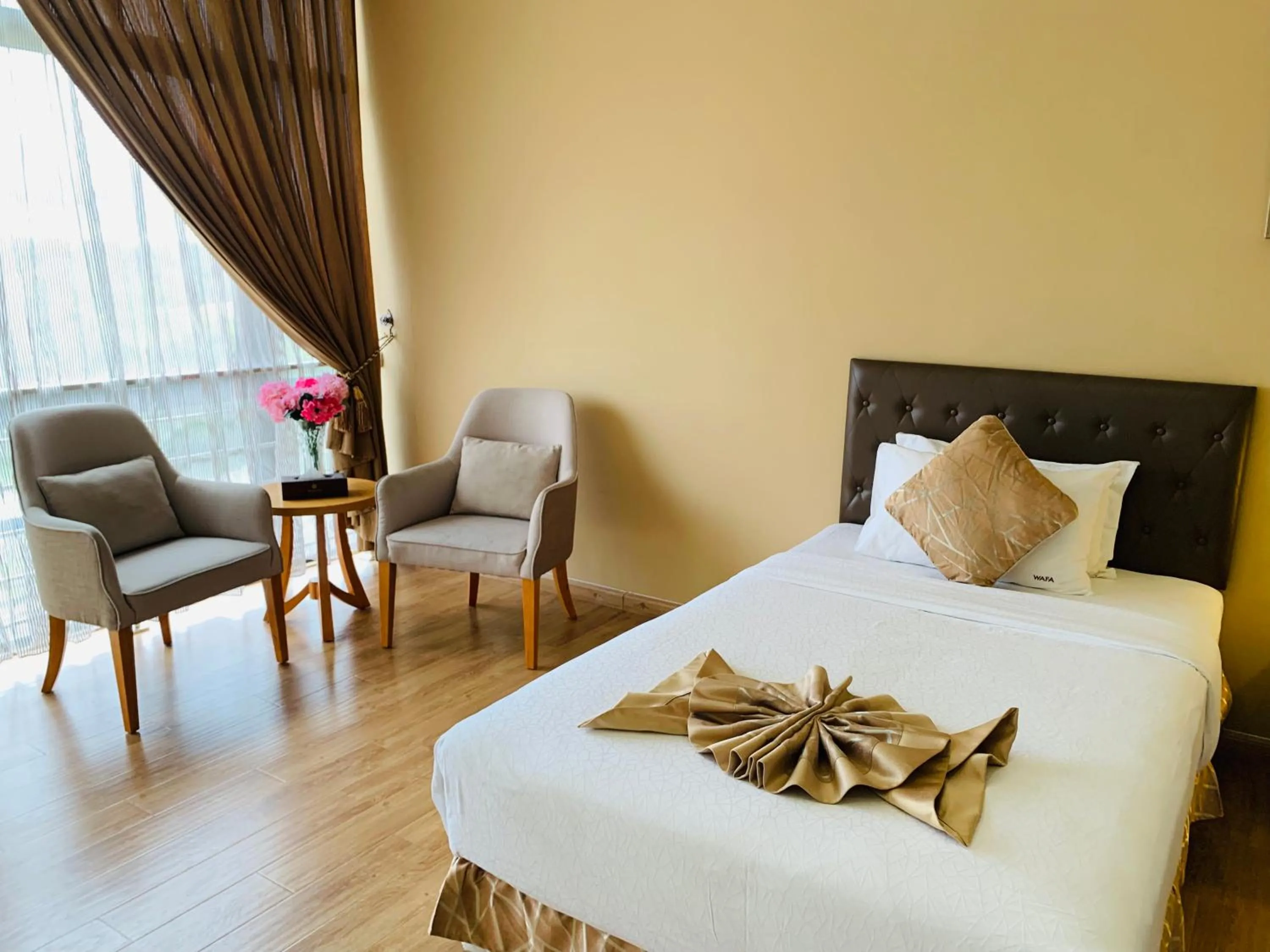 Seating area, Bed in Wafa Hotel & Apartment