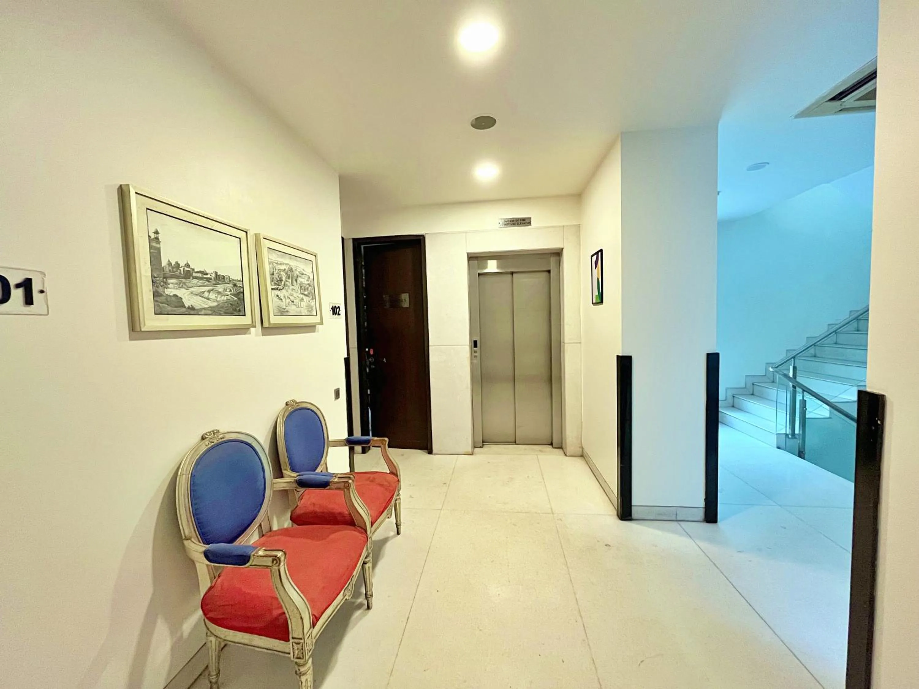 Seating area in Amber Inn by Orion Hotels