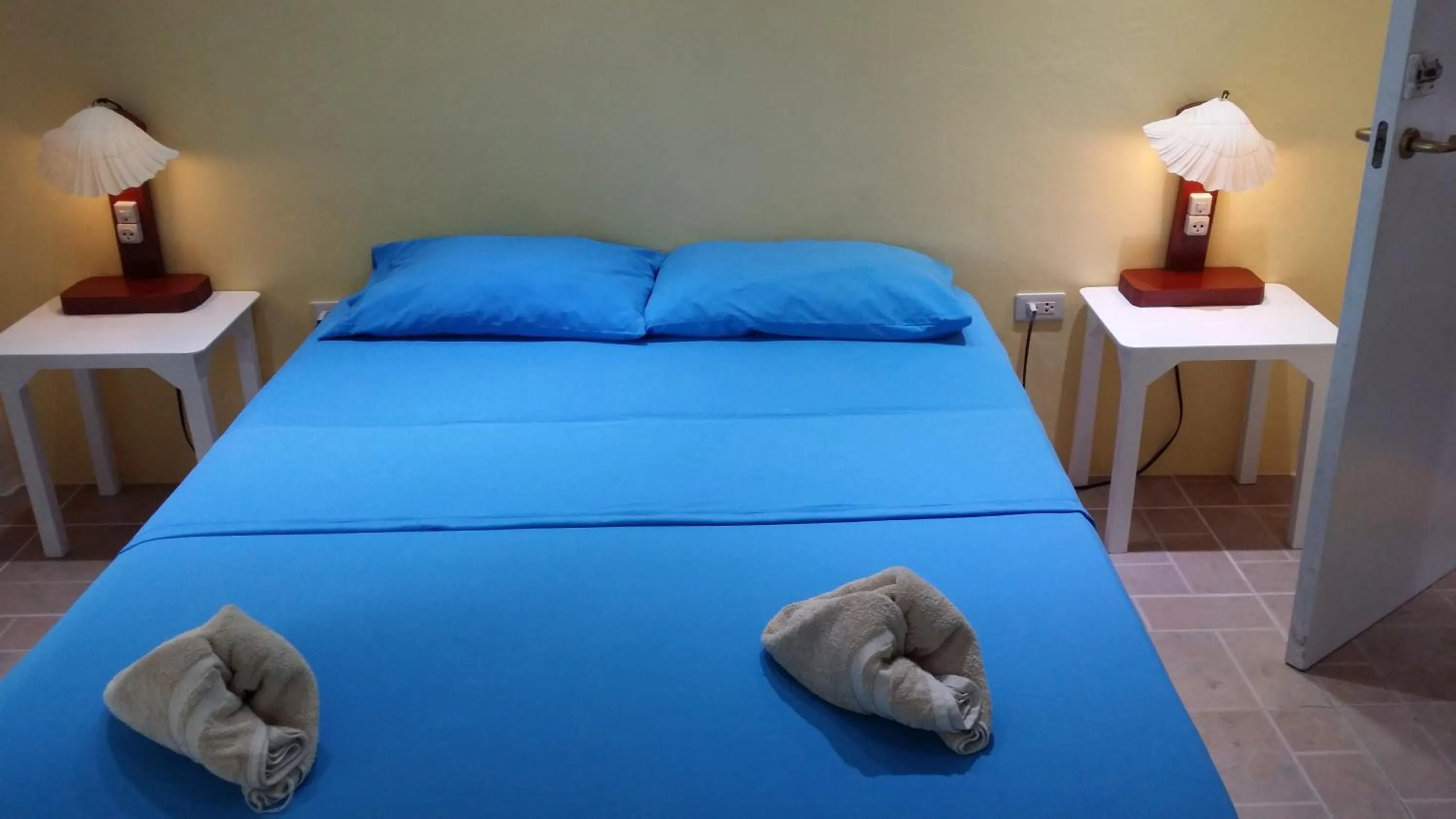 Bed in AABANA Beach & Watersport Resort