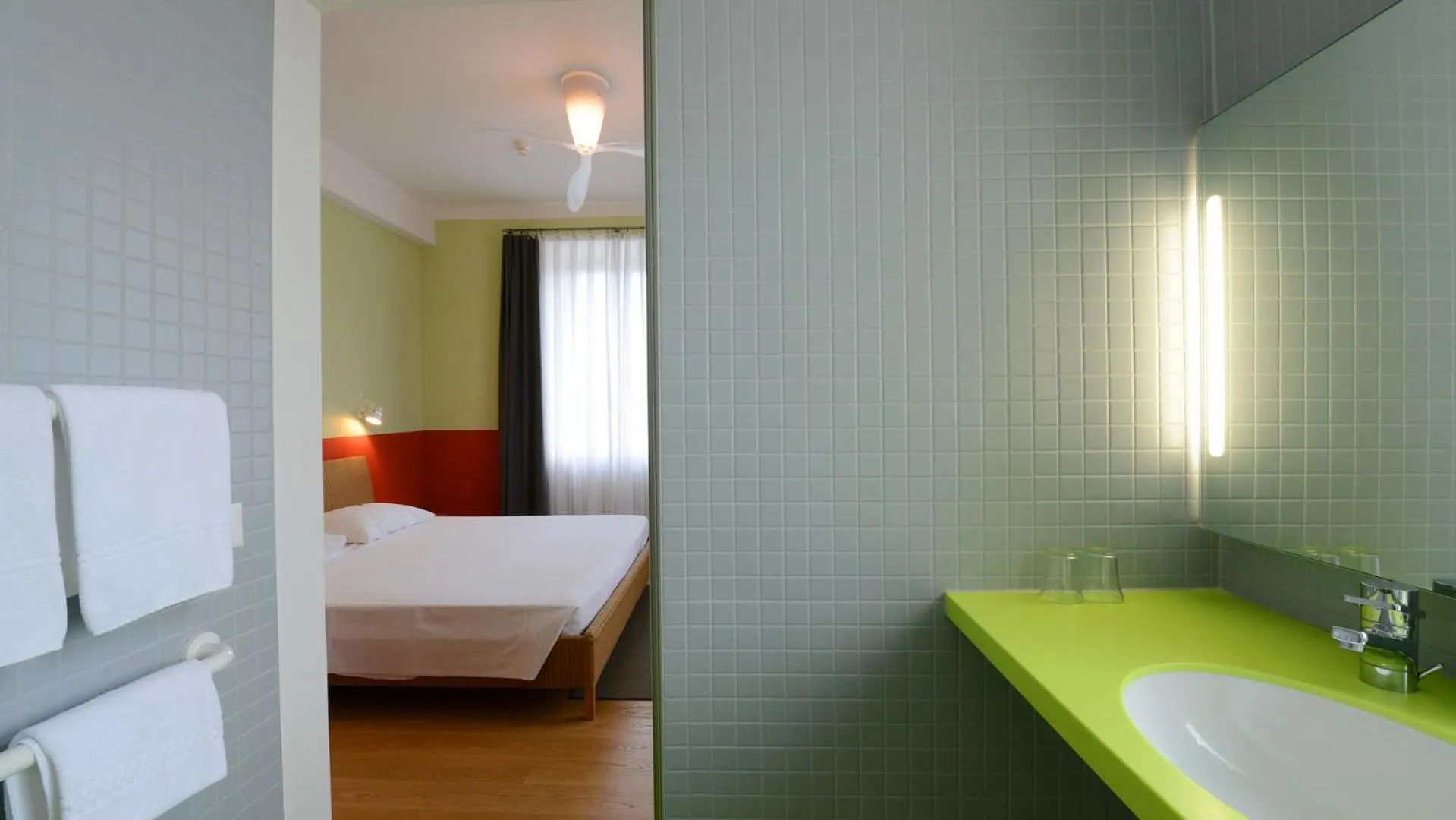 Photo of the whole room, Bed in Hotel Pestalozzi Lugano