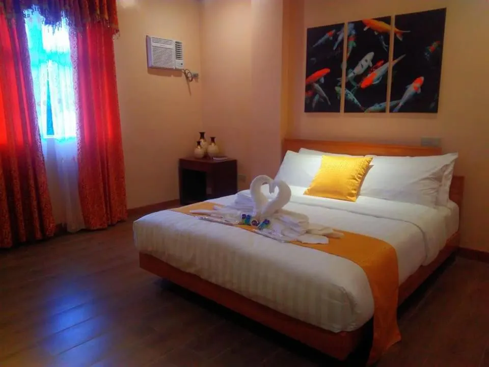 Bed in Royal Mansion Hotel