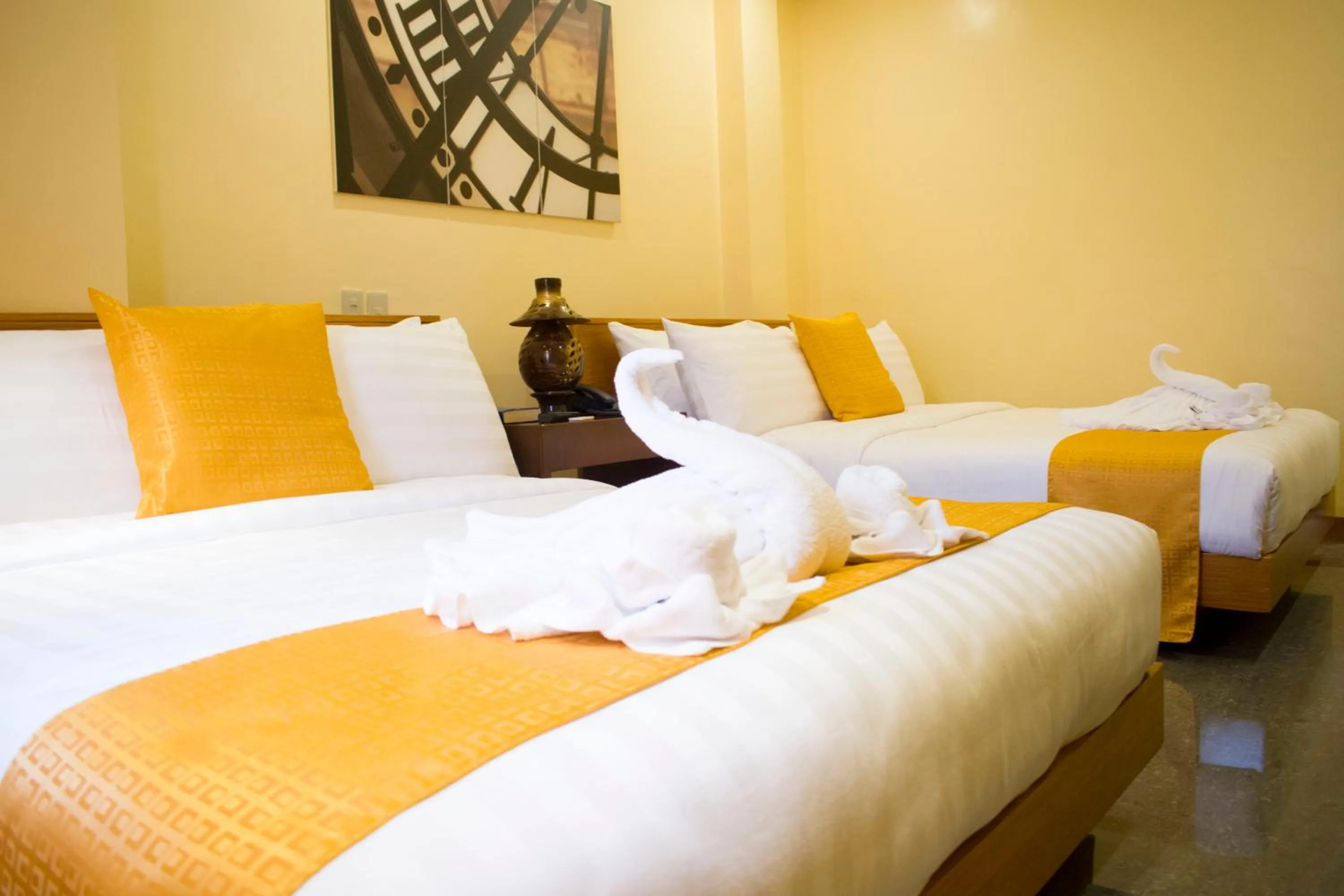 Bed in Royal Mansion Hotel