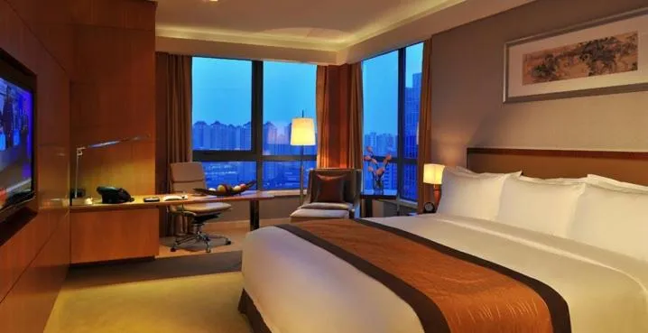 Bed in Royal Mansion Hotel