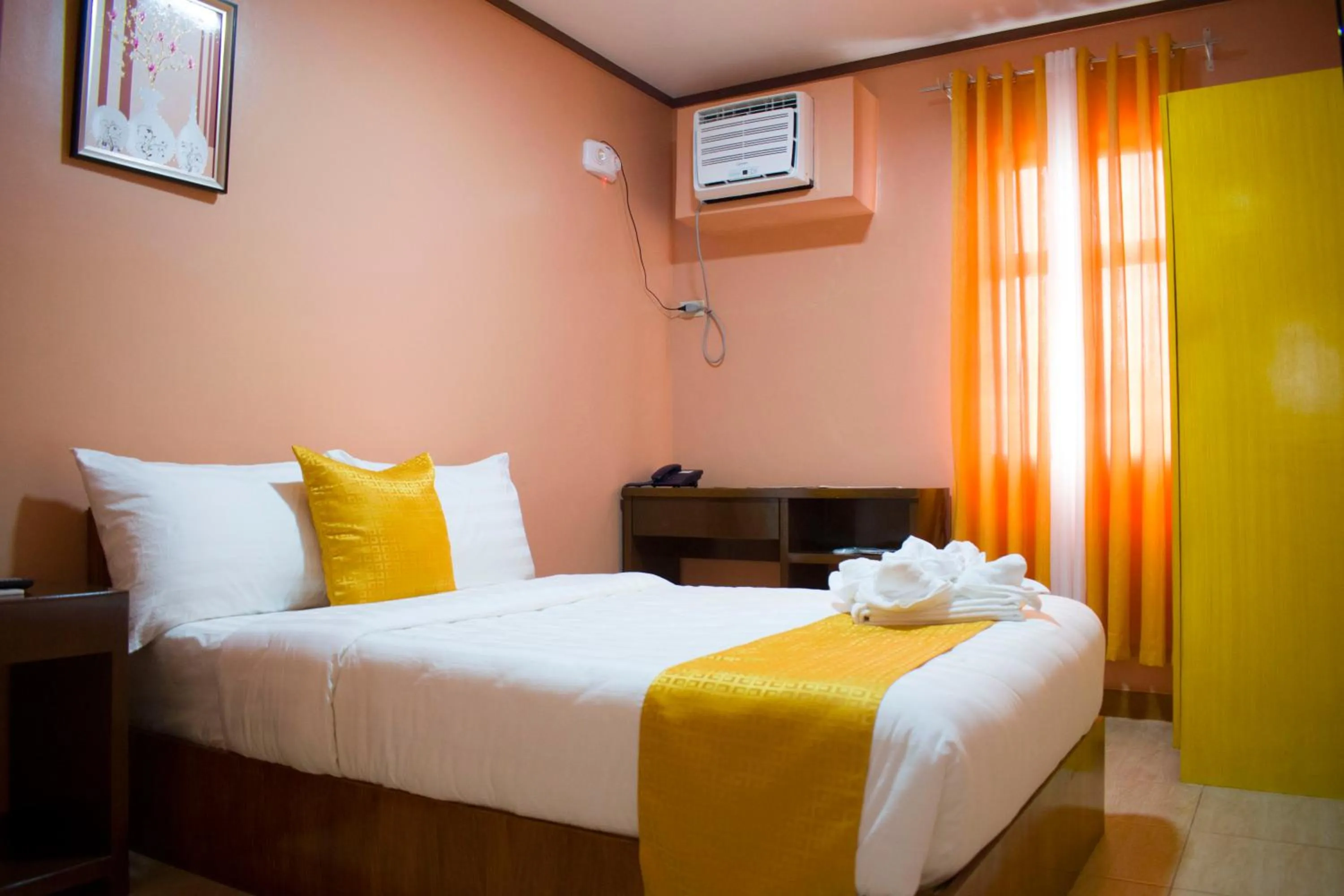 Bed in Royal Mansion Hotel