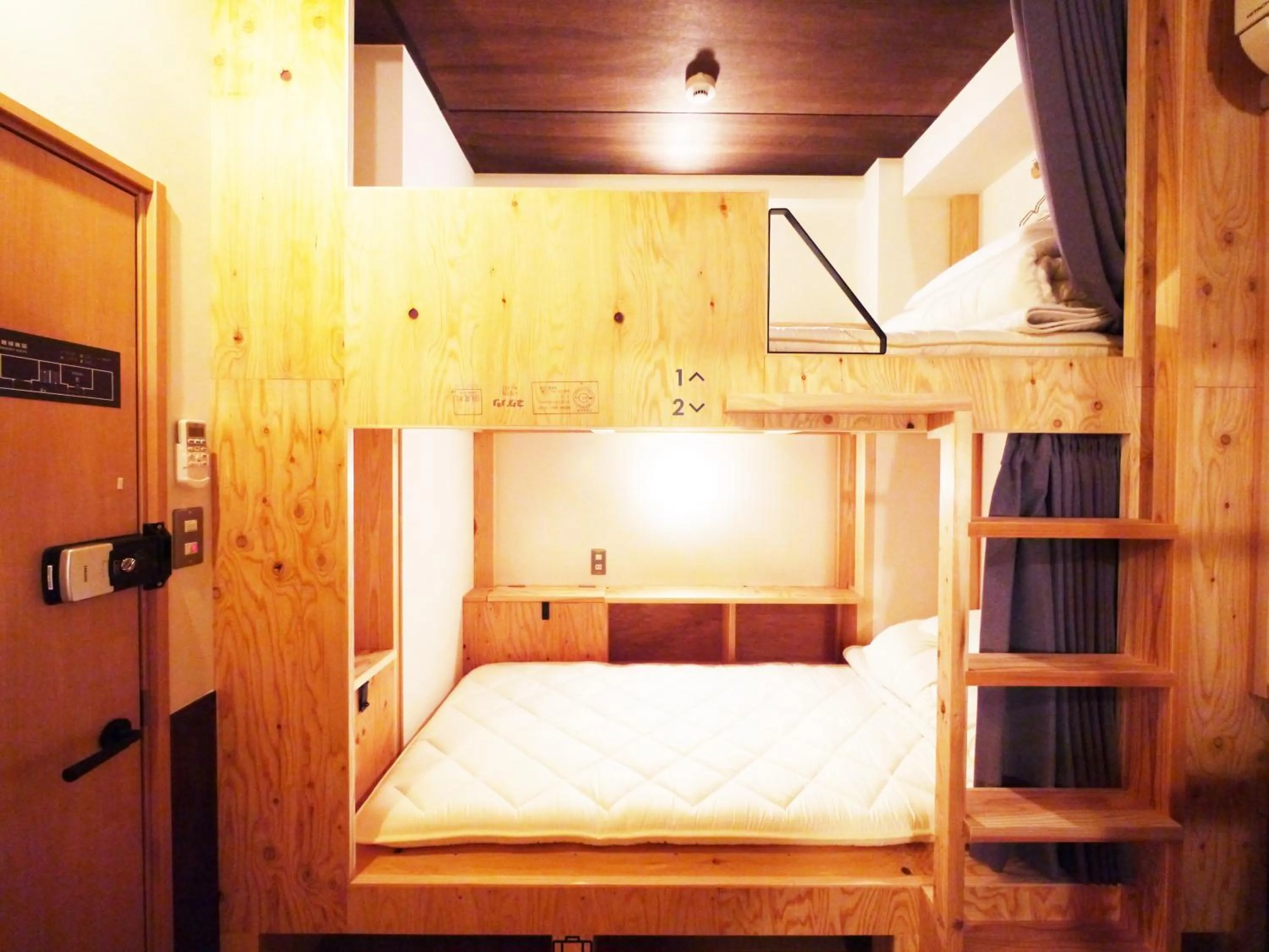 Photo of the whole room, Bed in Poly Hostel 2 Namba