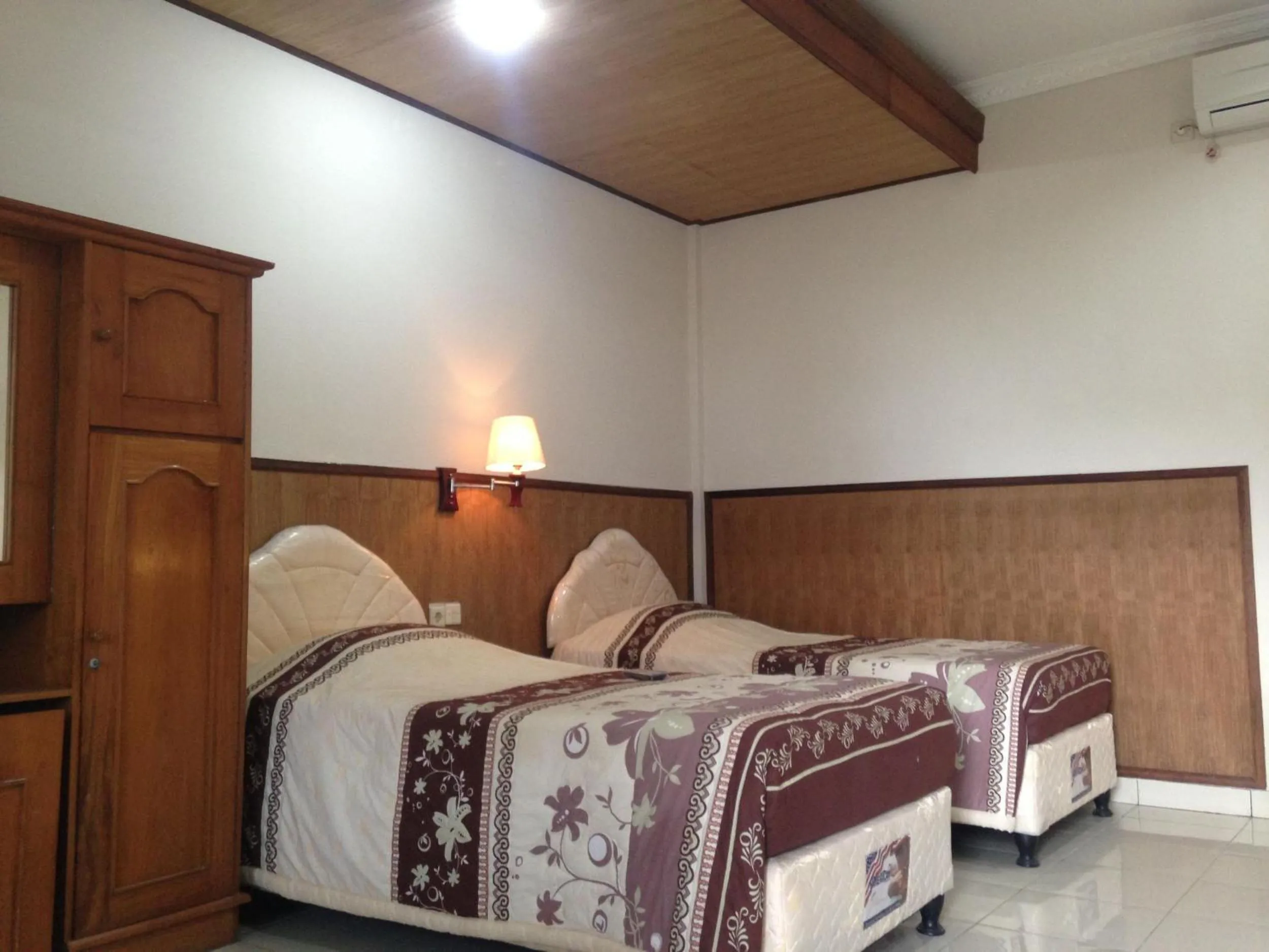 Photo of the whole room, Bed in Dewa Bharata Bungalows Candidasa
