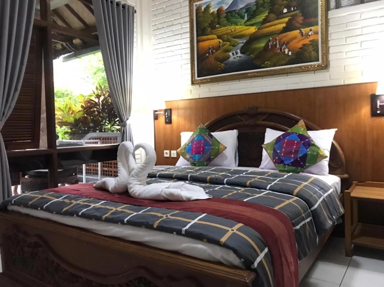 Bed in Dewa Bharata Bungalows Ubud