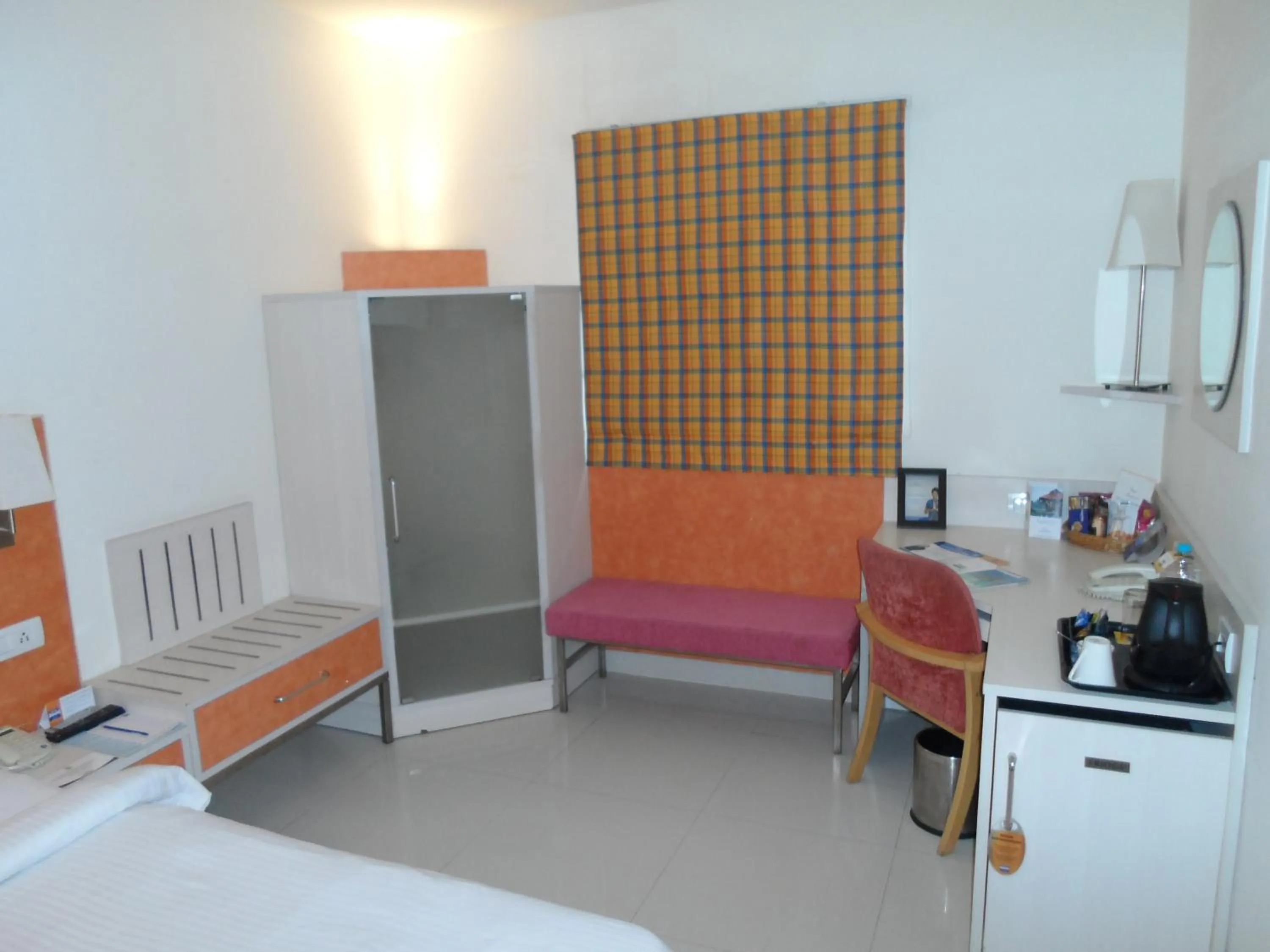 Seating area, Bed in Aditya Hometel