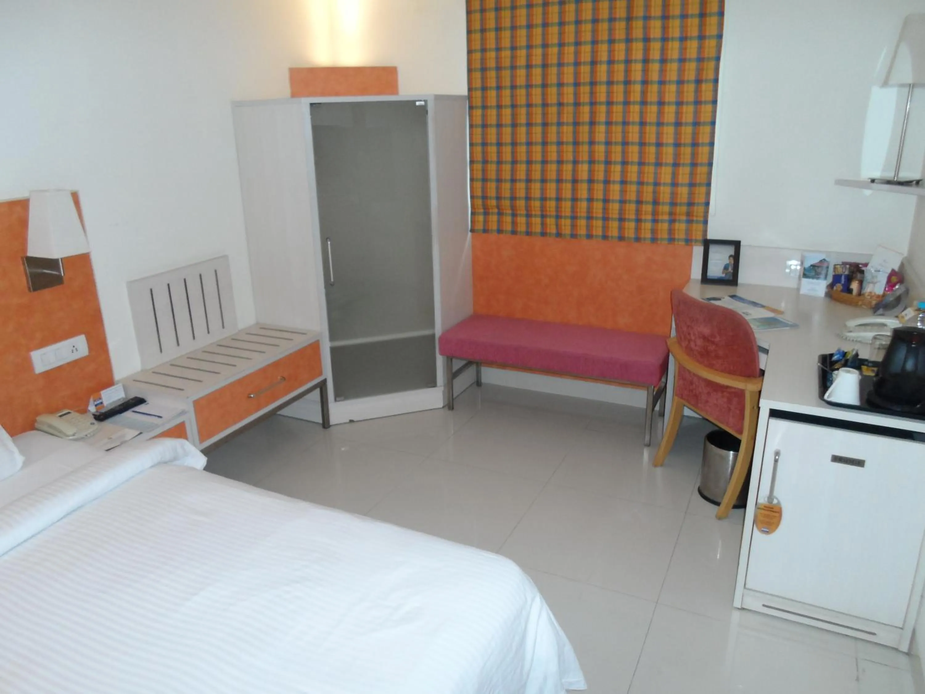 Seating area, Bed in Aditya Hometel