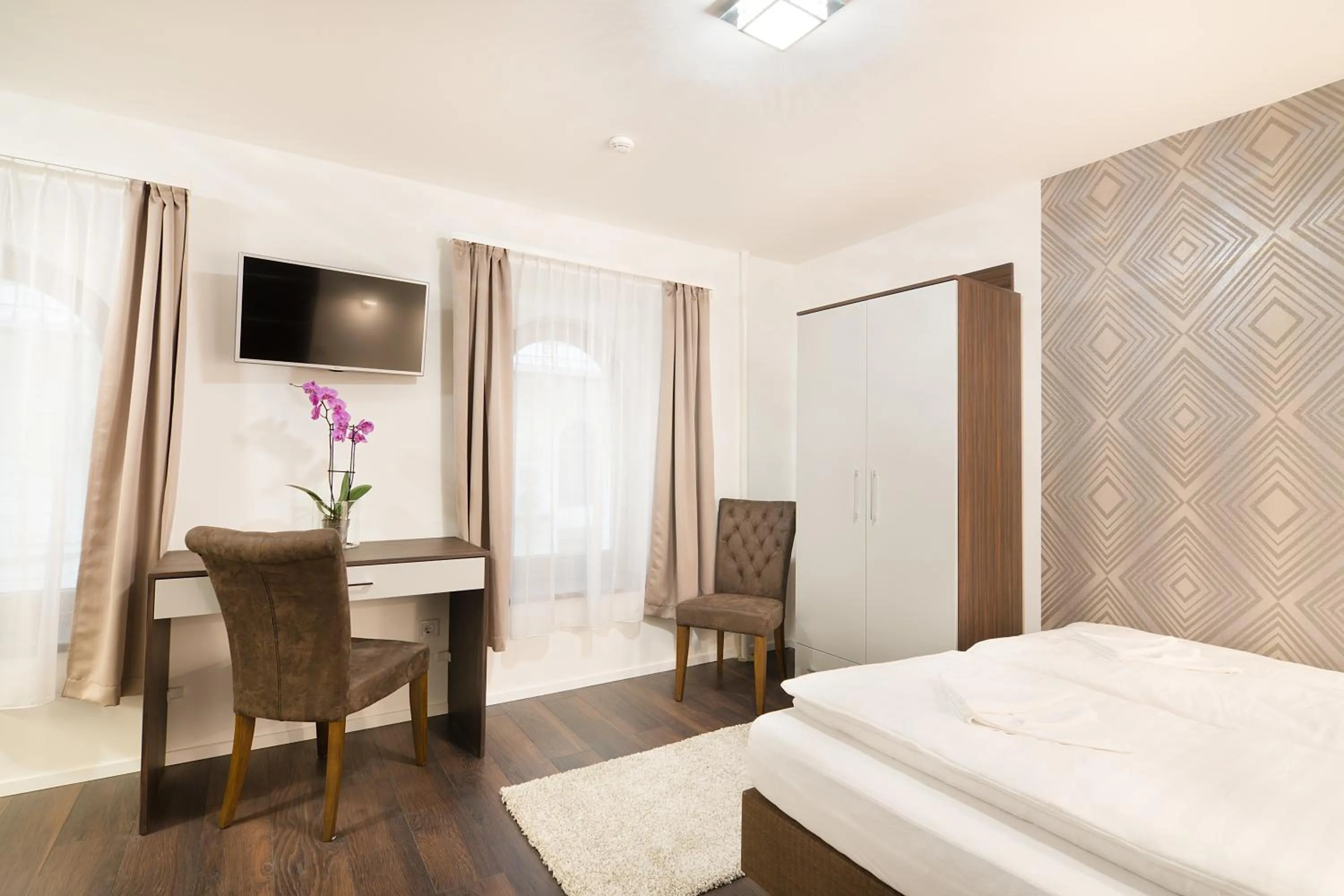 Bed in Paulay Downtown Apartments