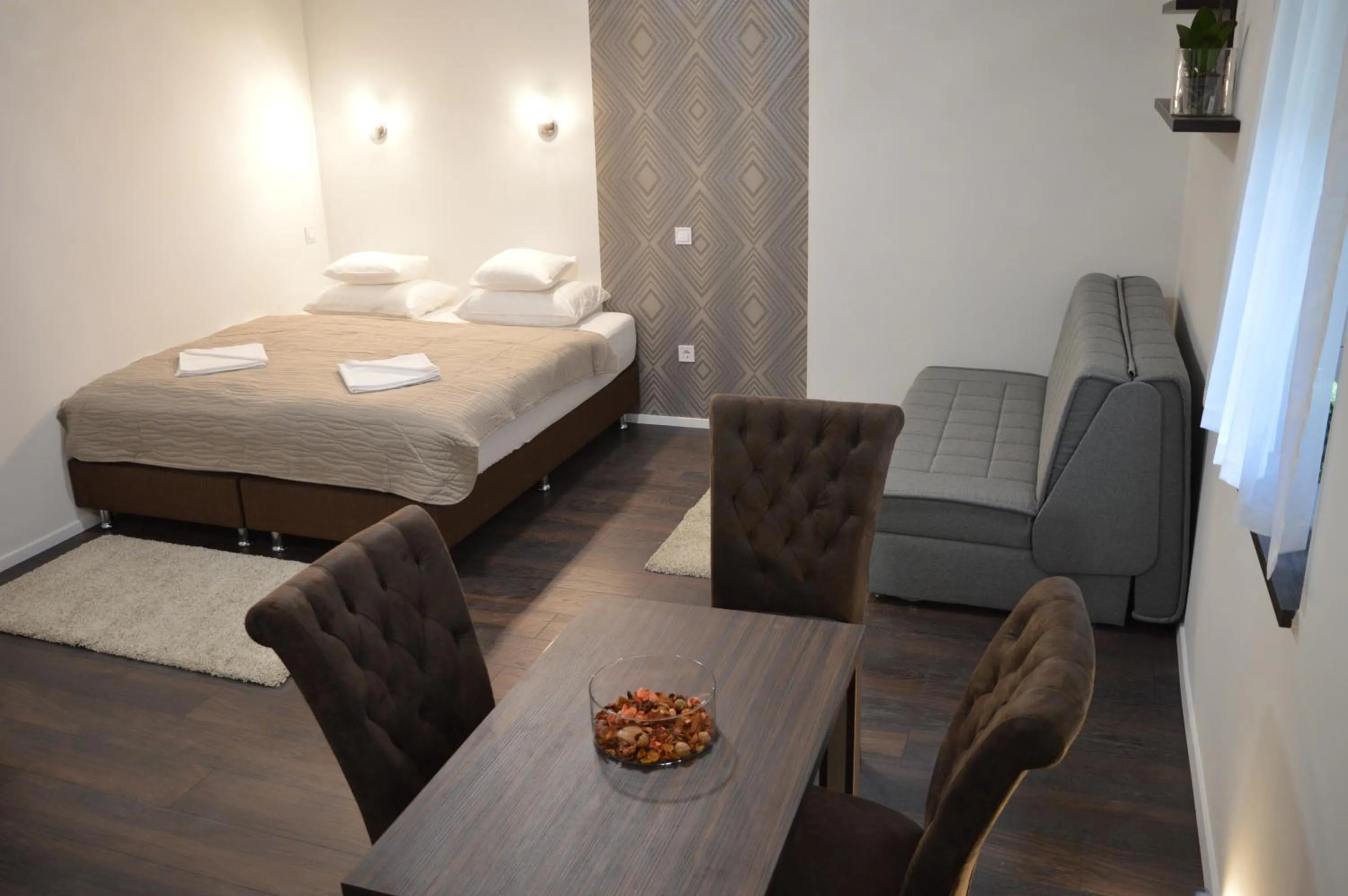 Bed in Paulay Downtown Apartments