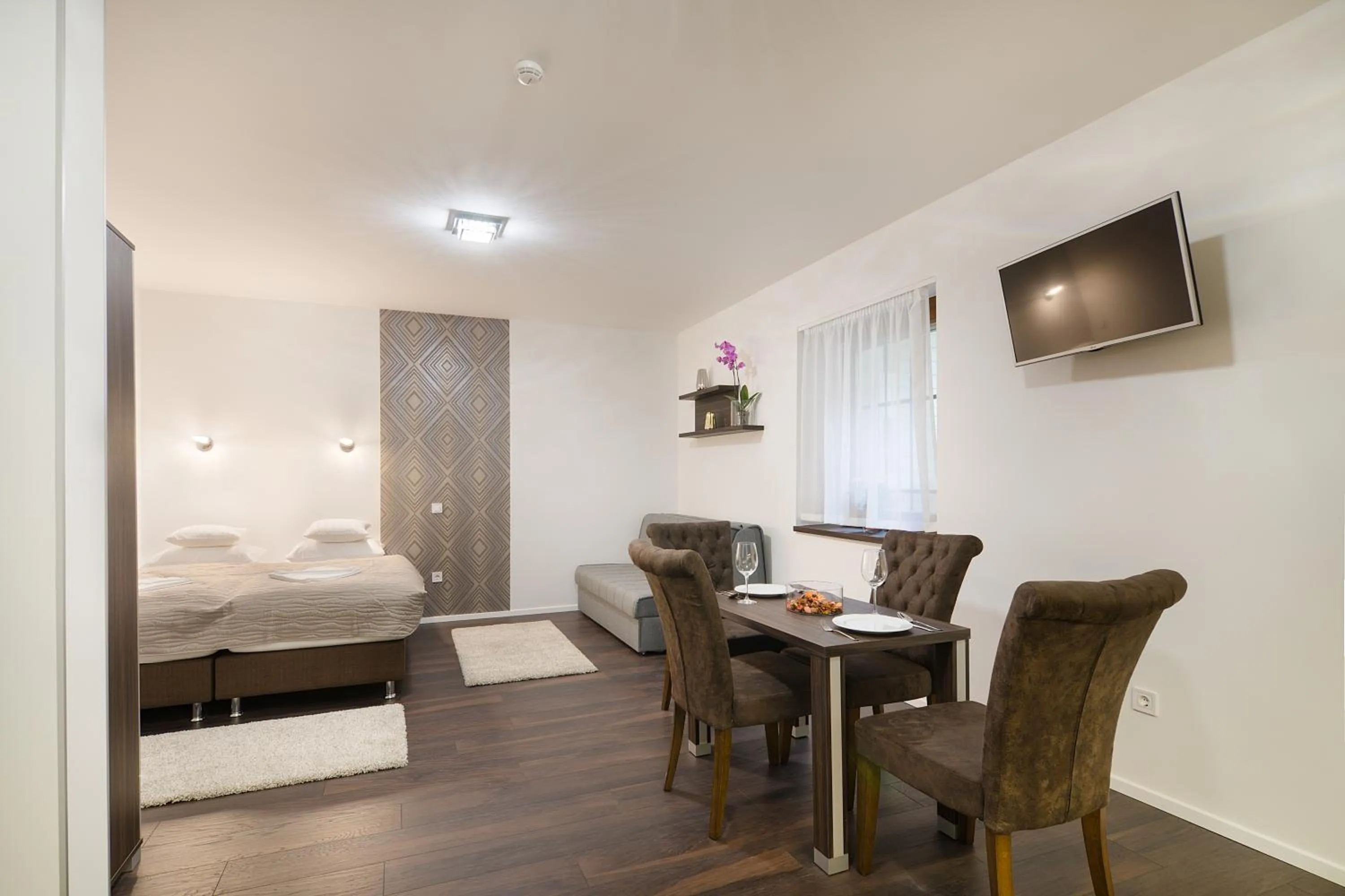 Bed in Paulay Downtown Apartments