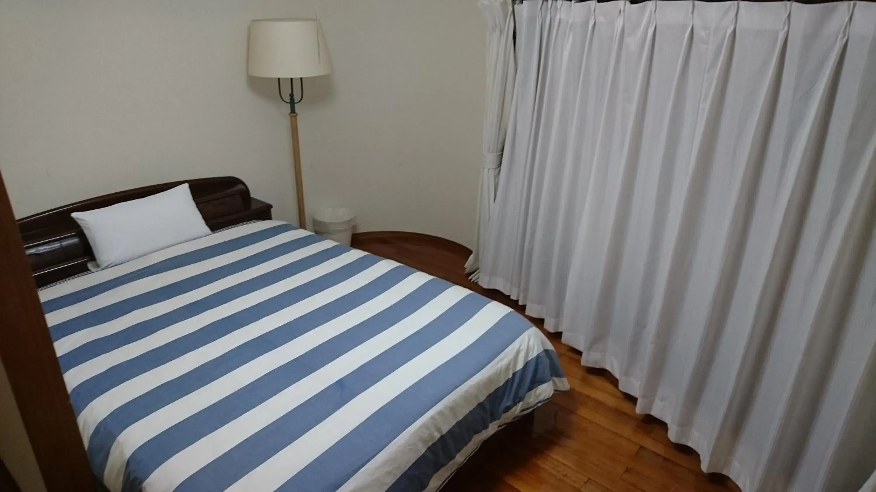 Bed in Kokusai Towns Inn Bed in Kokusai Towns Inn