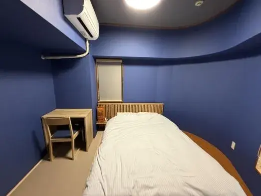 Bed in Kokusai Towns Inn Bed in Kokusai Towns Inn