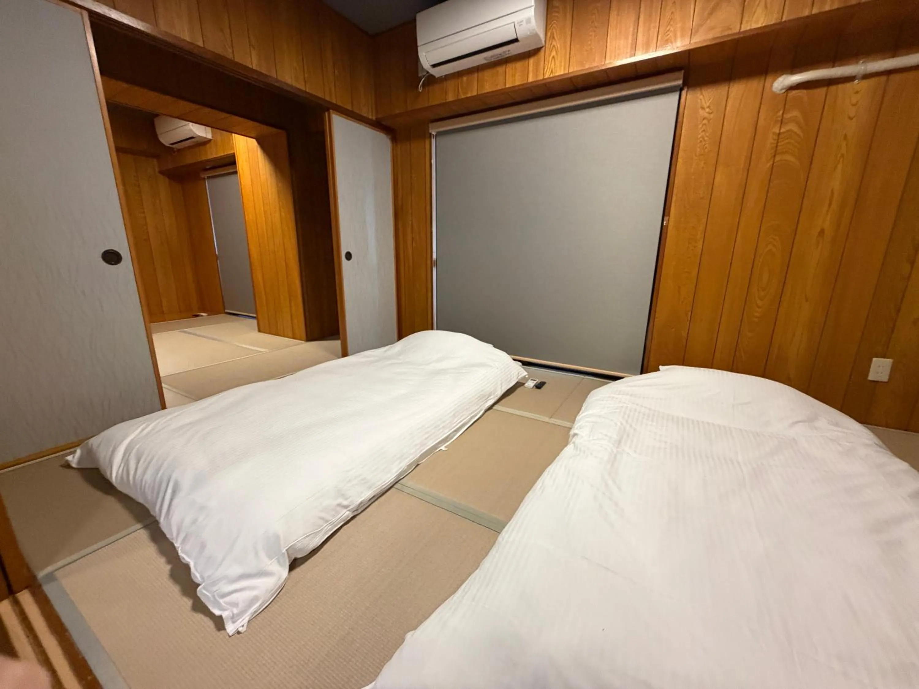 Bed in Kokusai Towns Inn