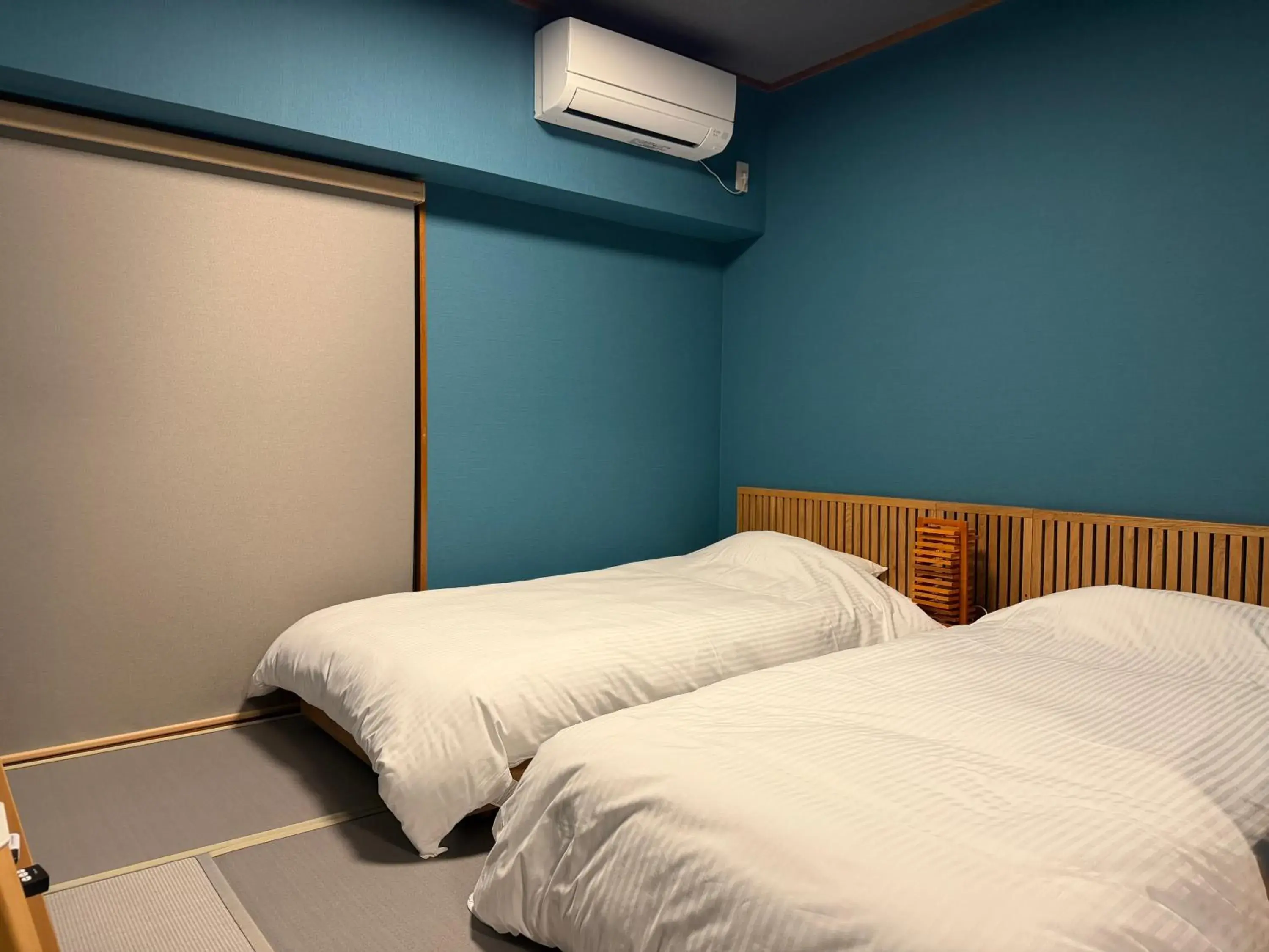 Bed in Kokusai Towns Inn Bed in Kokusai Towns Inn