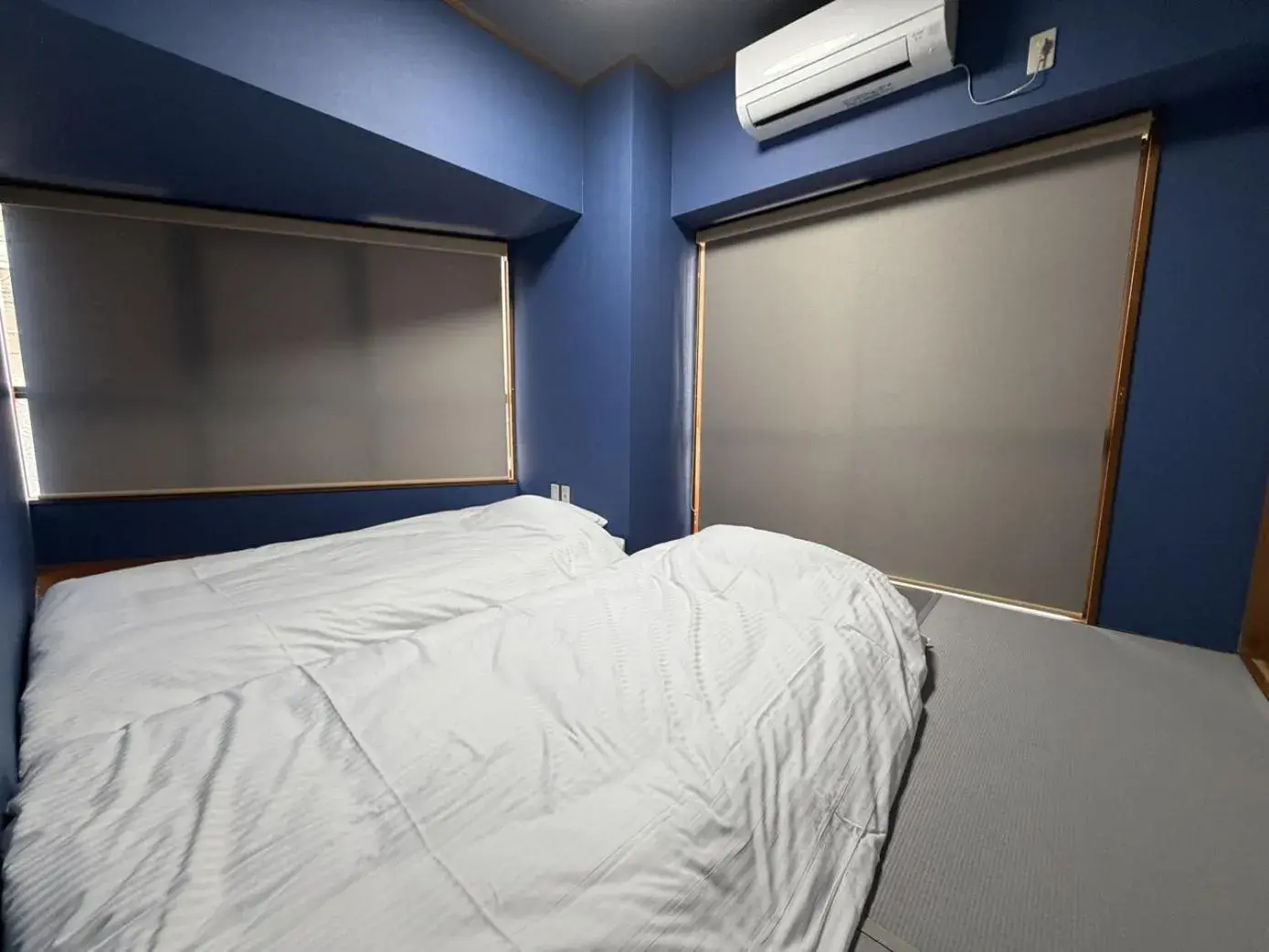 Bed in Kokusai Towns Inn Bed in Kokusai Towns Inn