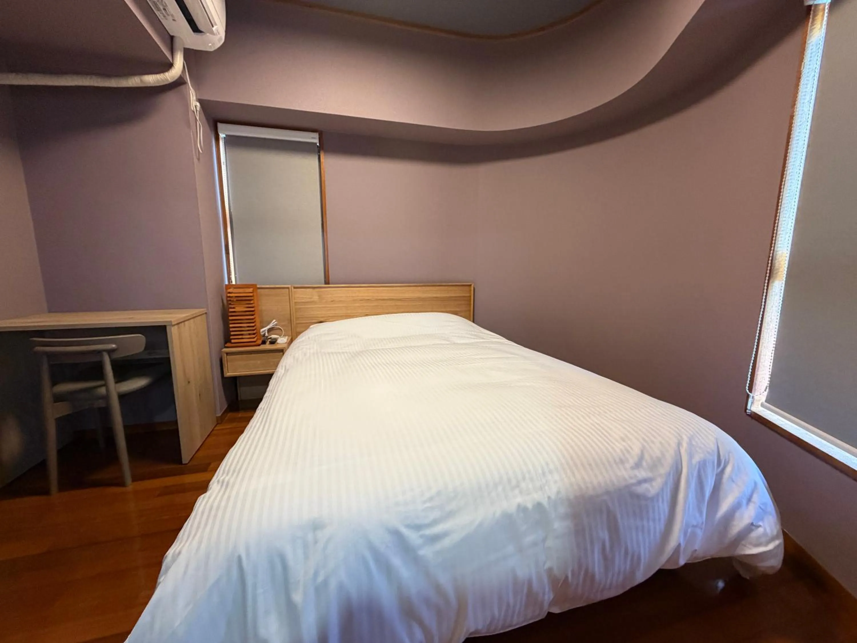 Bed in Kokusai Towns Inn