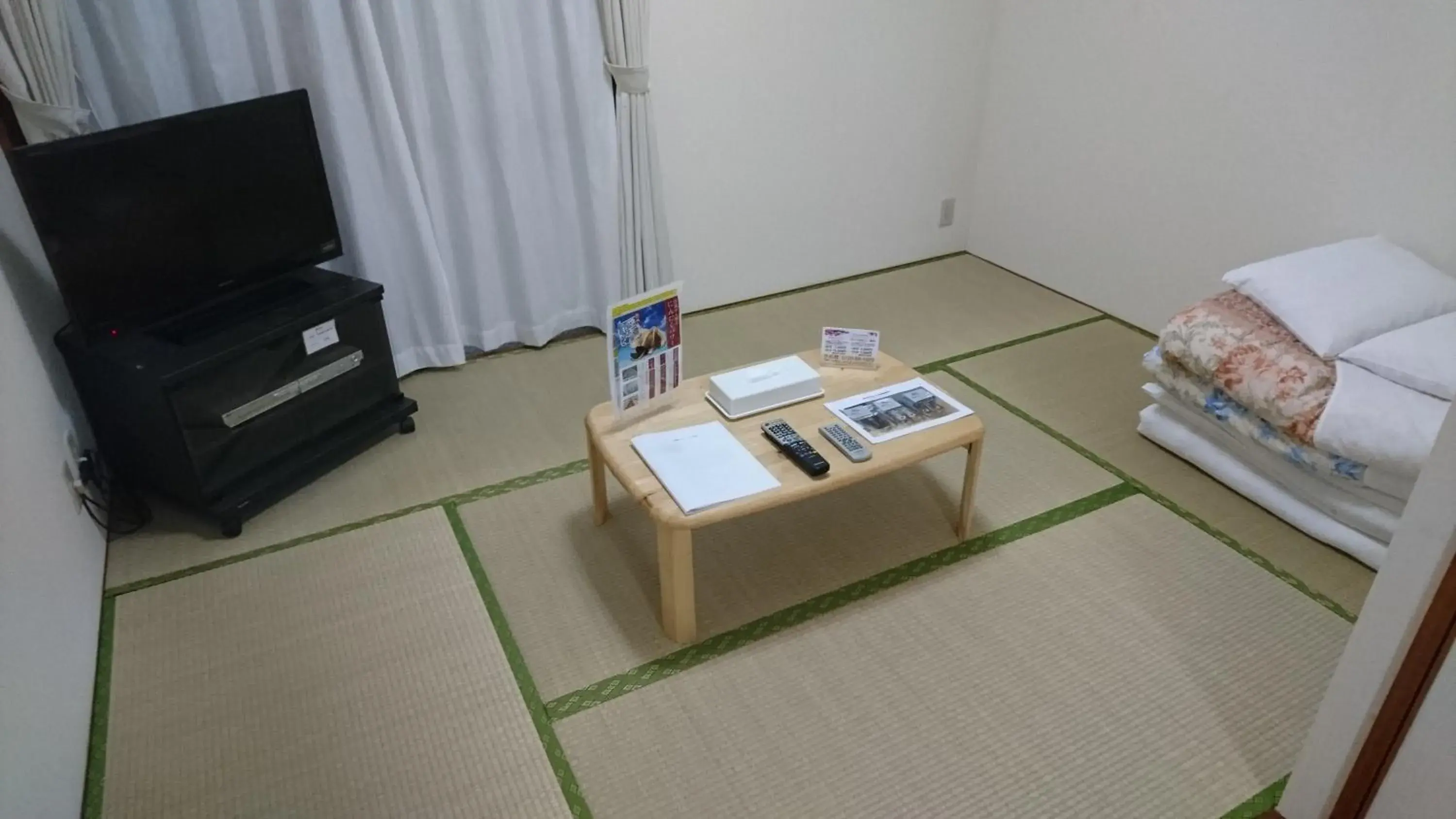 Bed in Kokusai Towns Inn Bed in Kokusai Towns Inn