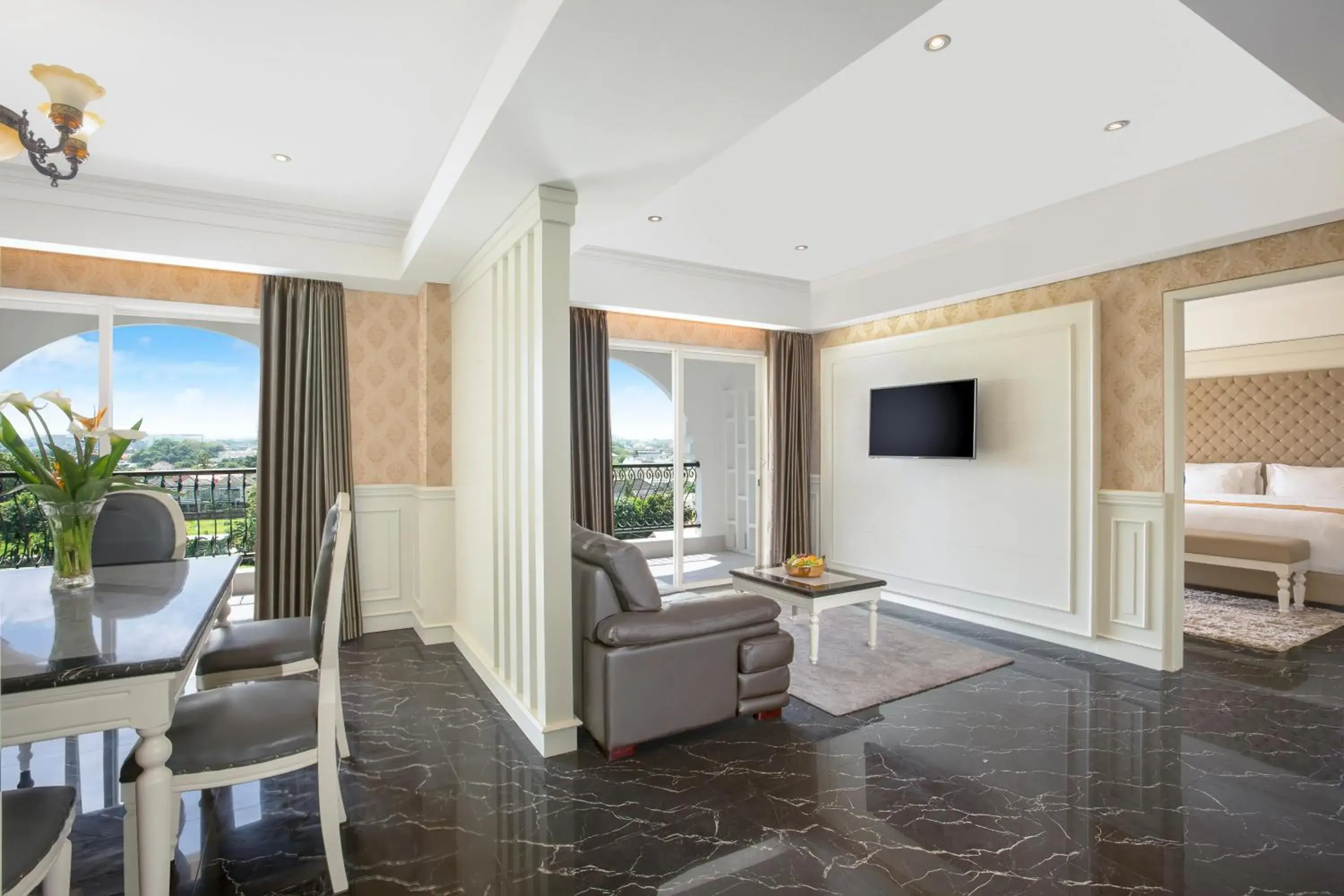 Communal lounge/ TV room, Bed in Grand Rohan Jogja Communal lounge/ TV room, Bed in Grand Rohan Jogja